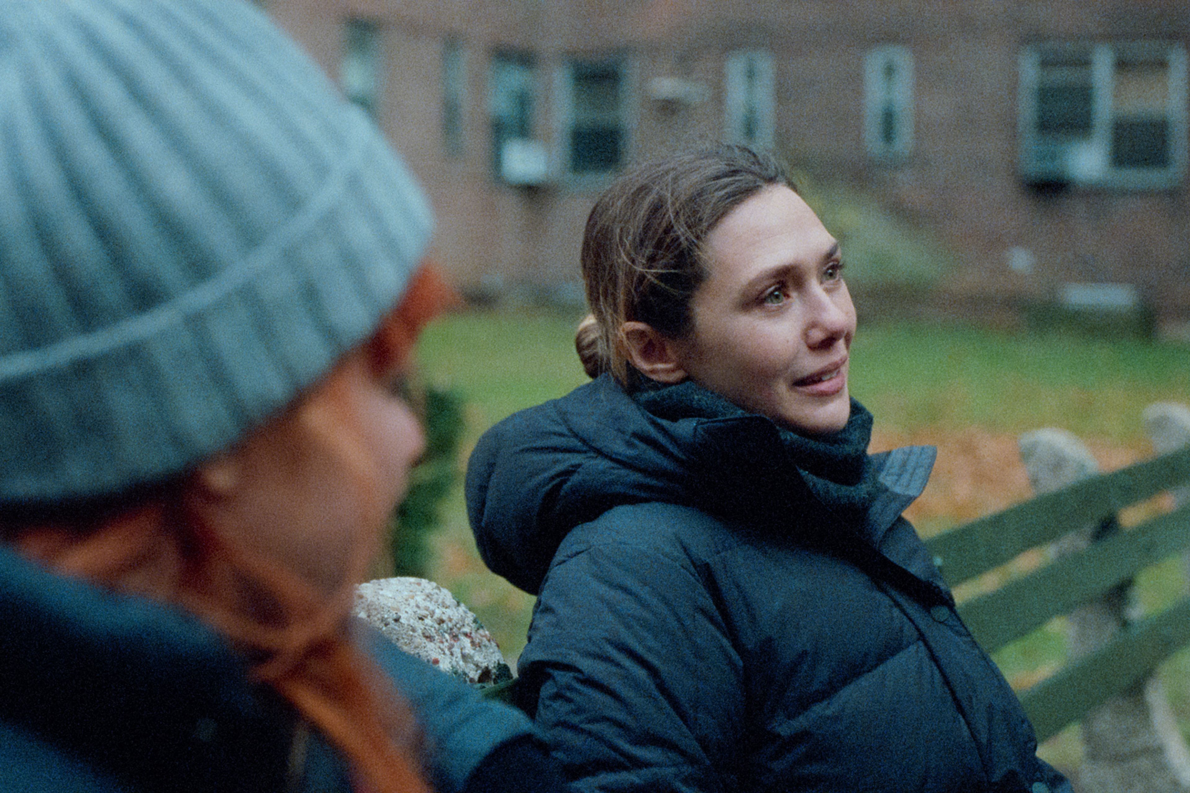 This image released by Netflix shows Natasha Lyonne, left, and Elizabeth Olsen in a scene from "His Three Daughters." (Netflix via AP)