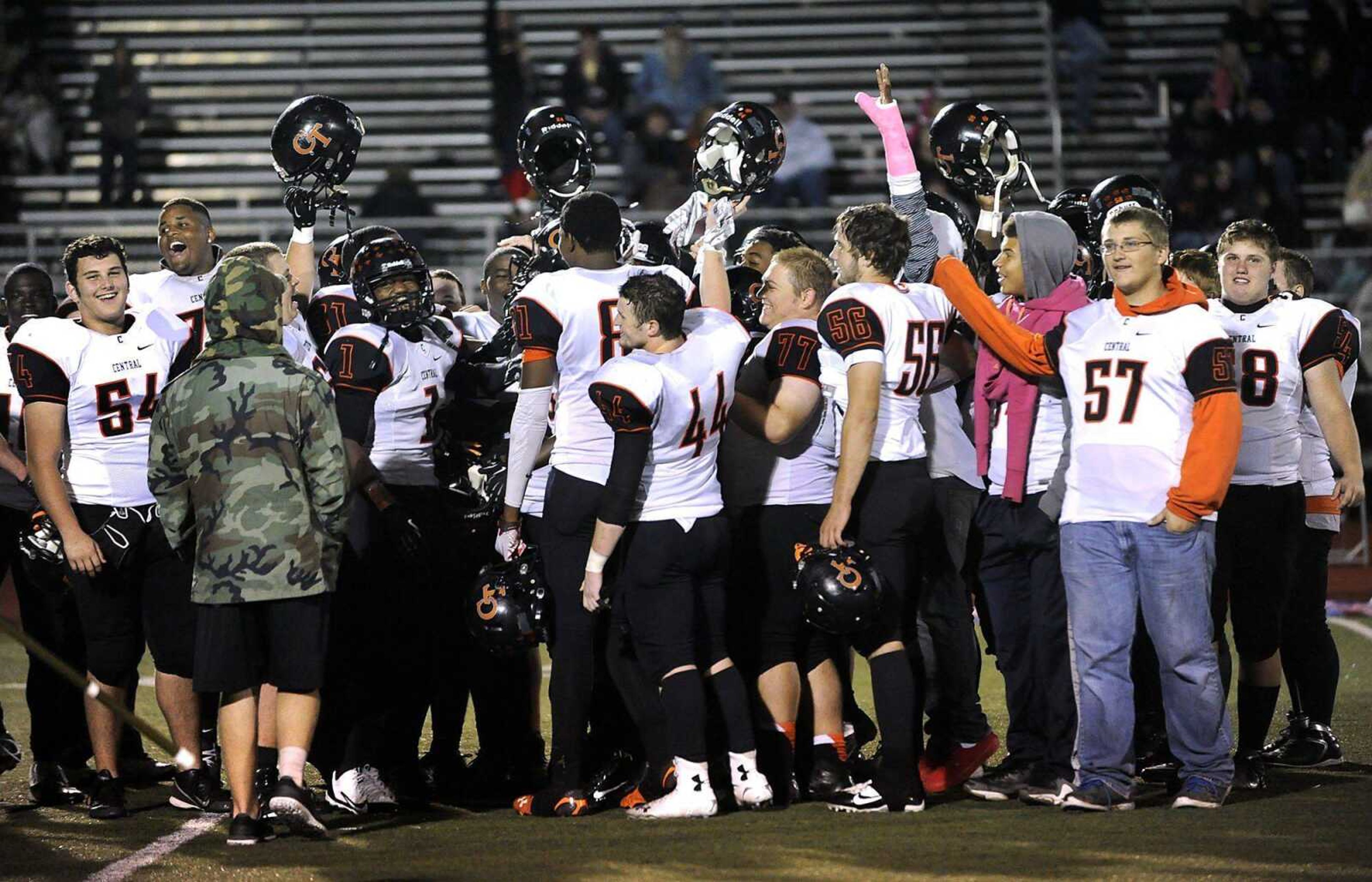 The Cape Central football team celebrates after their victory over Farmington that also clinched the SEMO North conference championship on Friday, Oct. 3, 2014 in Farmington, Missouri. (Fred Lynch)