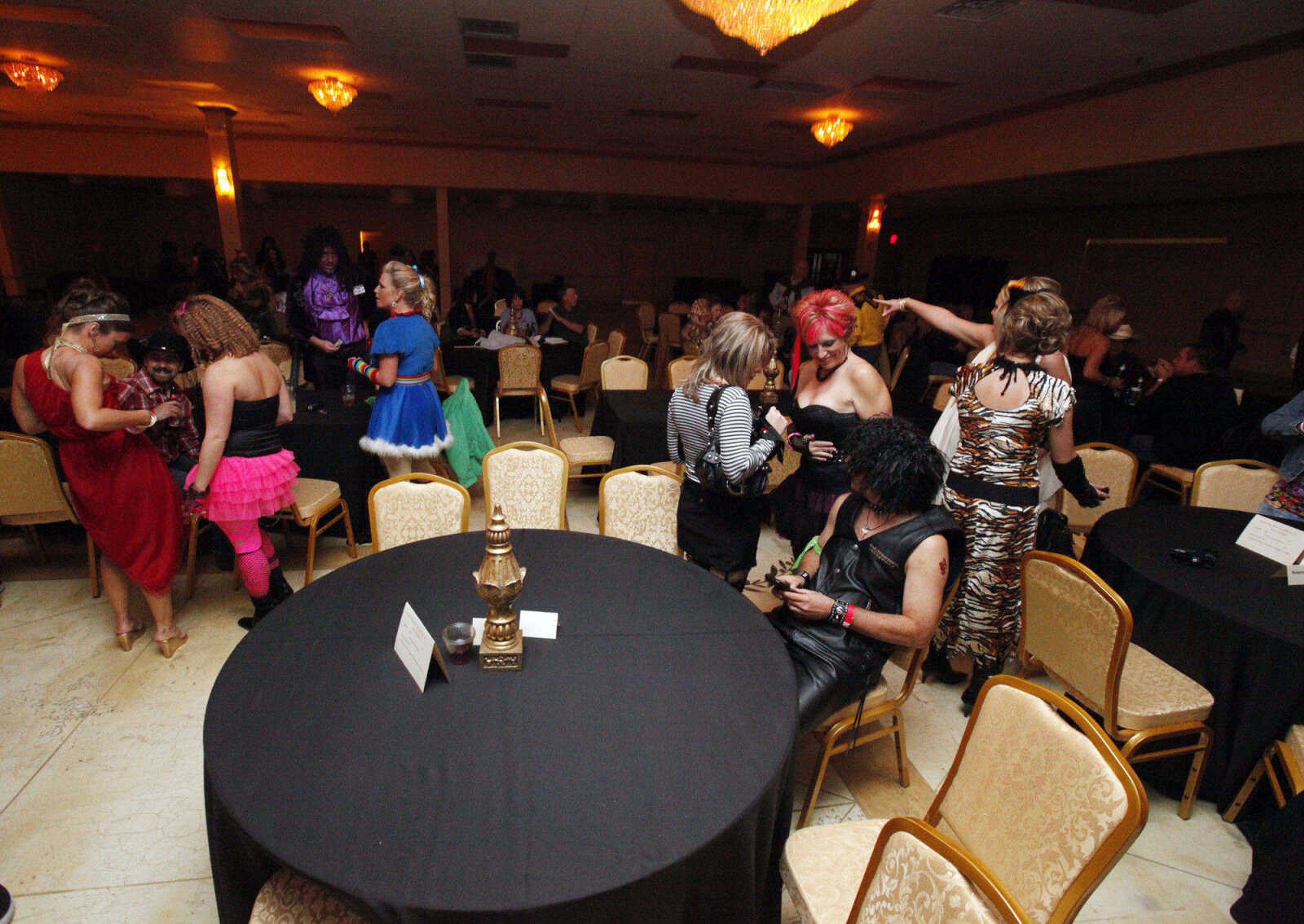 CHRIS MACKLER ~ photos@semissourian.com

Partygoers at The Venue's Mega Halloween Bash in Cape Girardeau on Saturday, Oct. 30, 2010. According to The Venue owner and operator Mike Jessup, 300 pre-sale tickets were sold for the bash, which was set up as an 80's theme party.