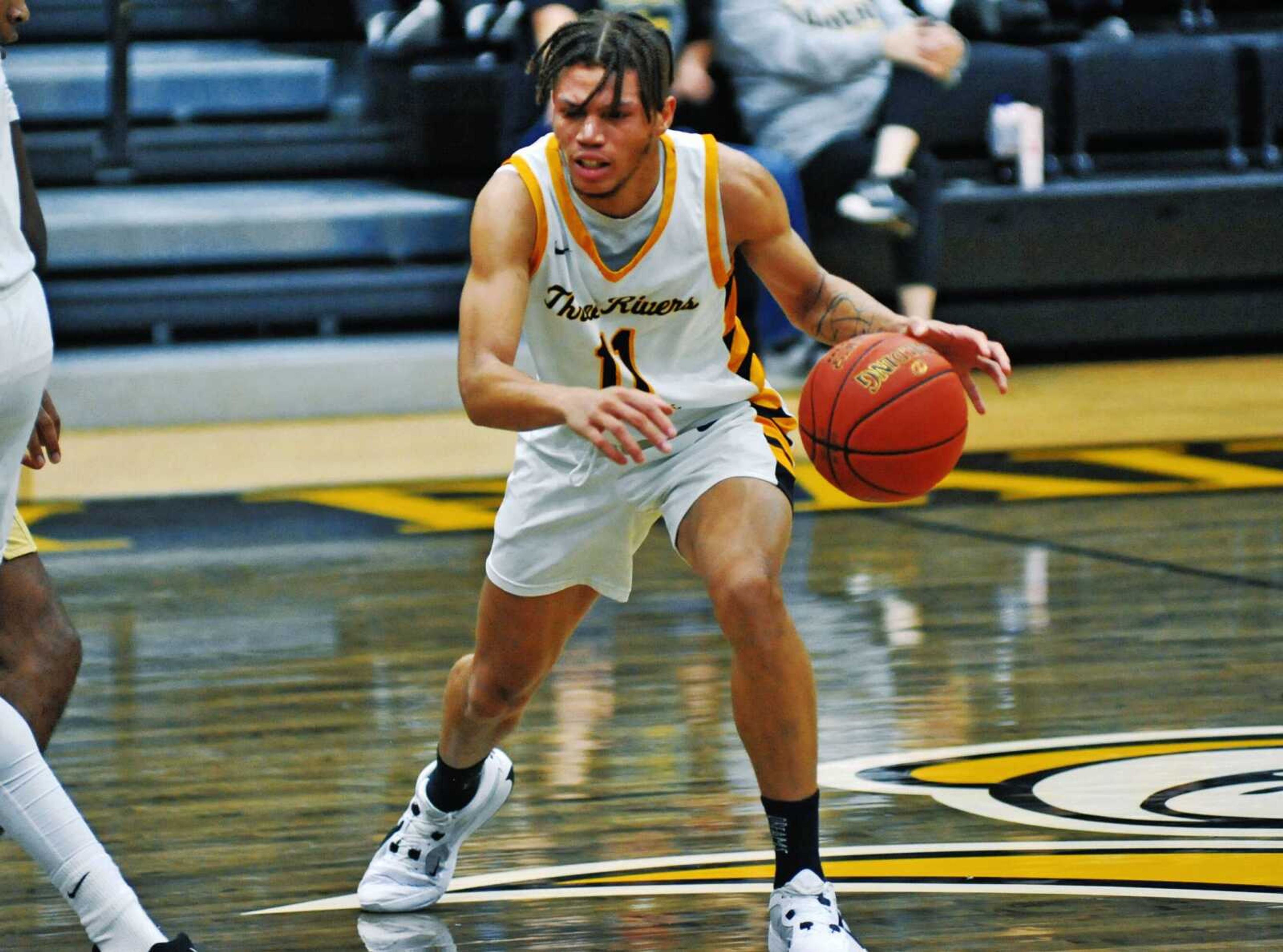 Three Rivers guard Meechie White moves around a screen during a recent Raider victory at the Libla Family Sports Complex. 