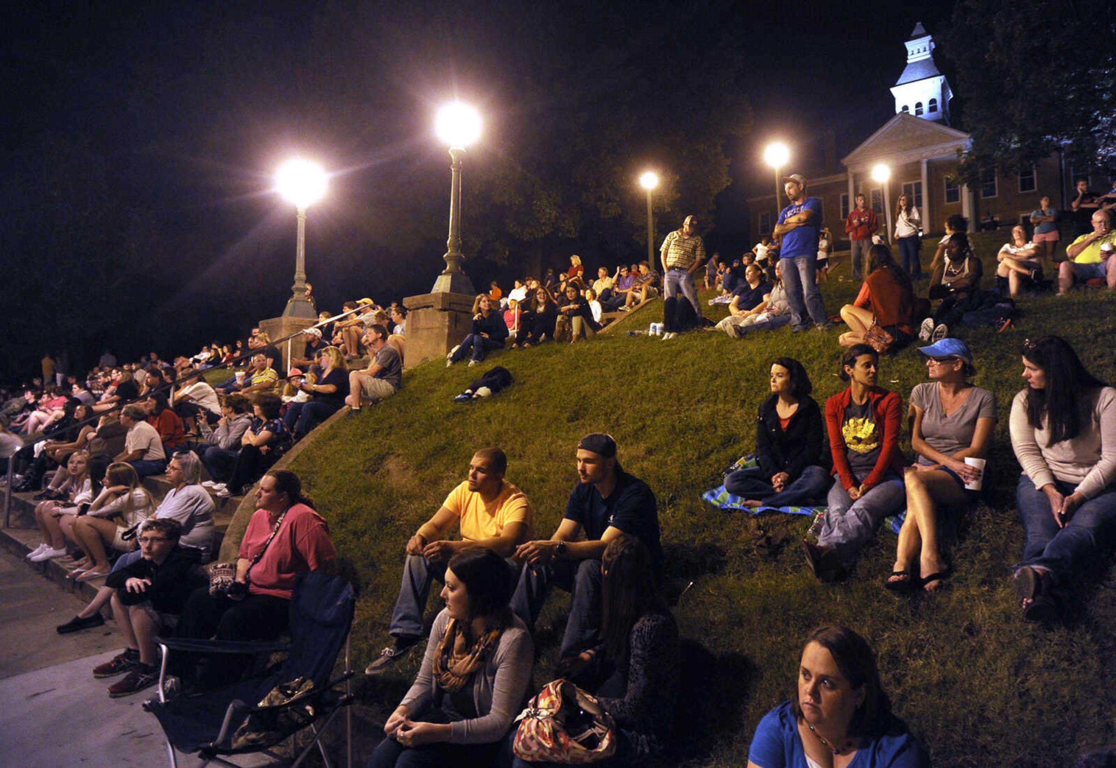 FRED LYNCH ~ flynch@semissourian.com
Spectators watch from the terraces of Common Pleas Courthouse Park as the scene around The Bar is prepared for "Gone Girl" filming Friday, Sept. 27, 2013 in downtown Cape Girardeau.