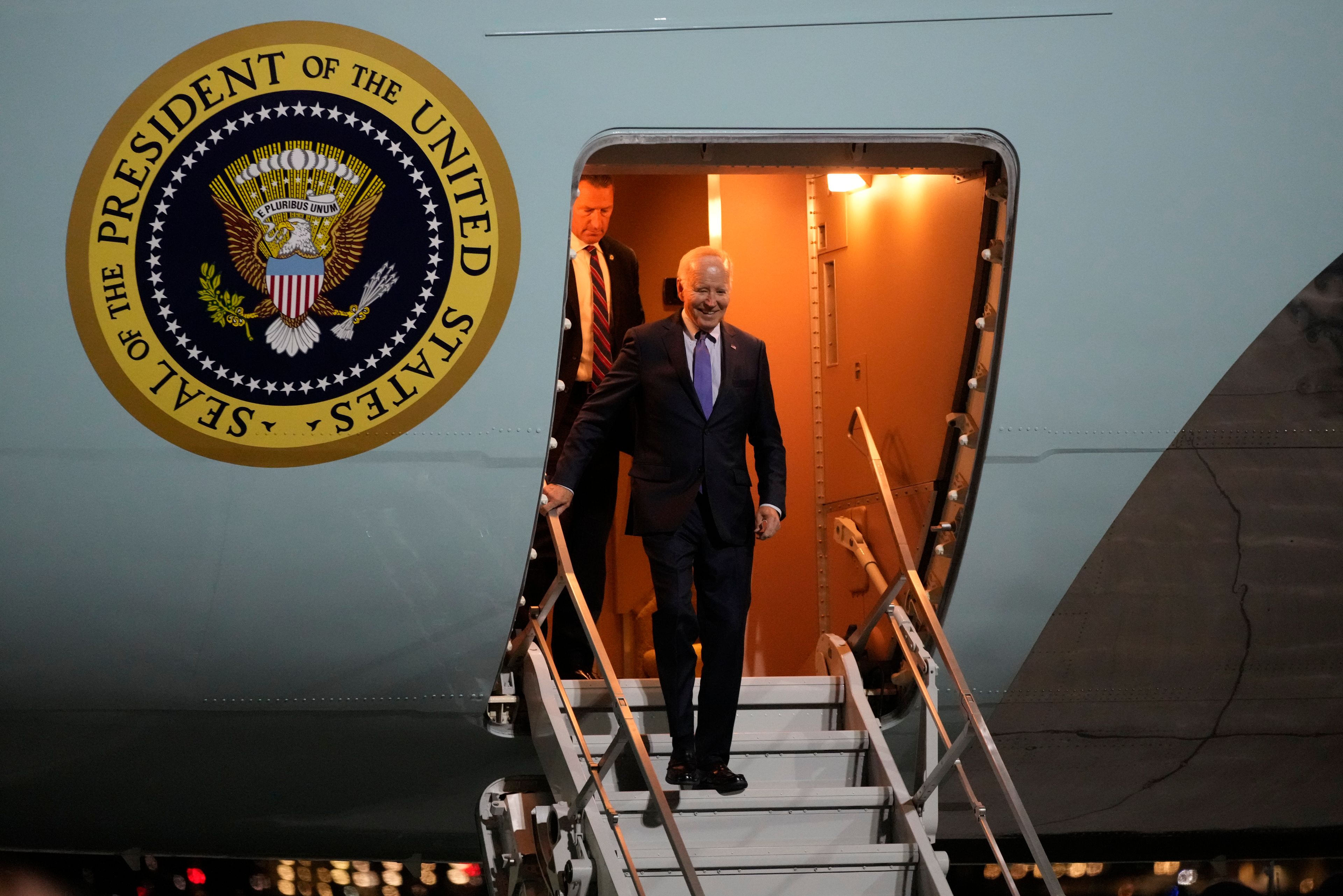 President Joe Biden walks down the stairs of Air Force One as he arrives at Brandenburg Airport in Schoenefeld near Berlin, Germany, Thursday, Oct. 17, 2024. (AP Photo/Ben Curtis)