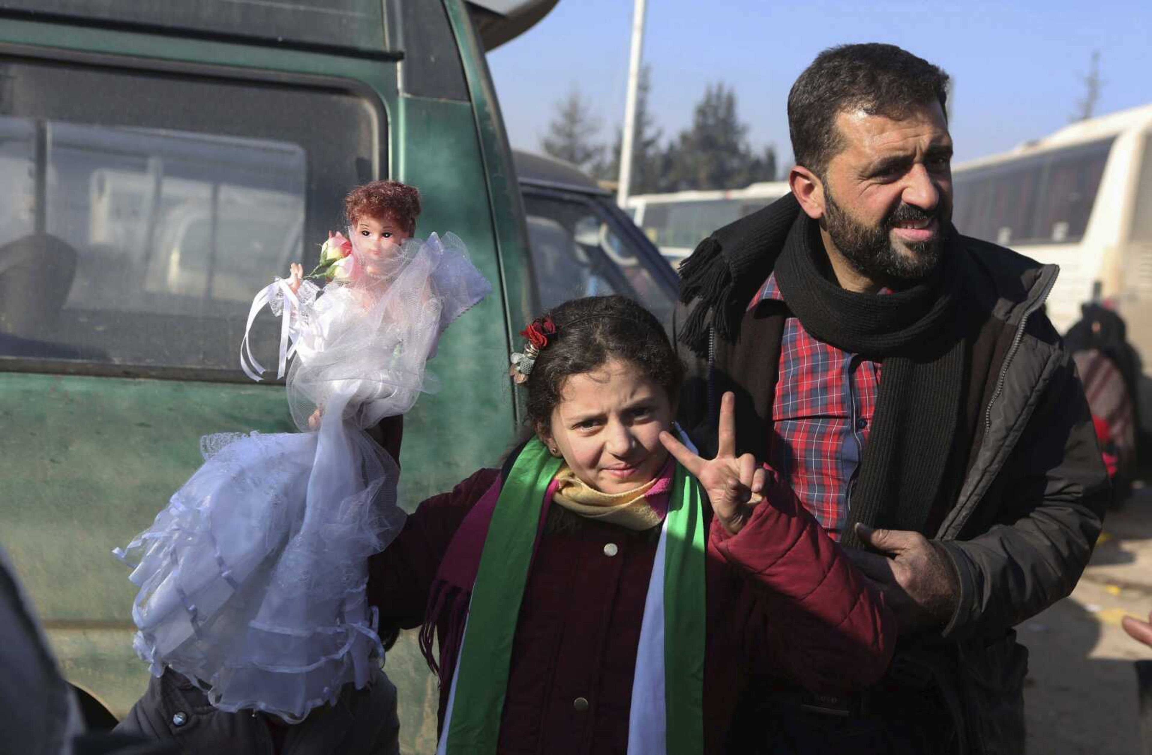 Syrians evacuated from the embattled Syrian city of Aleppo during the ceasefire arrive Tuesday at a refugee camp in Rashidin, near Idlib, Syria.