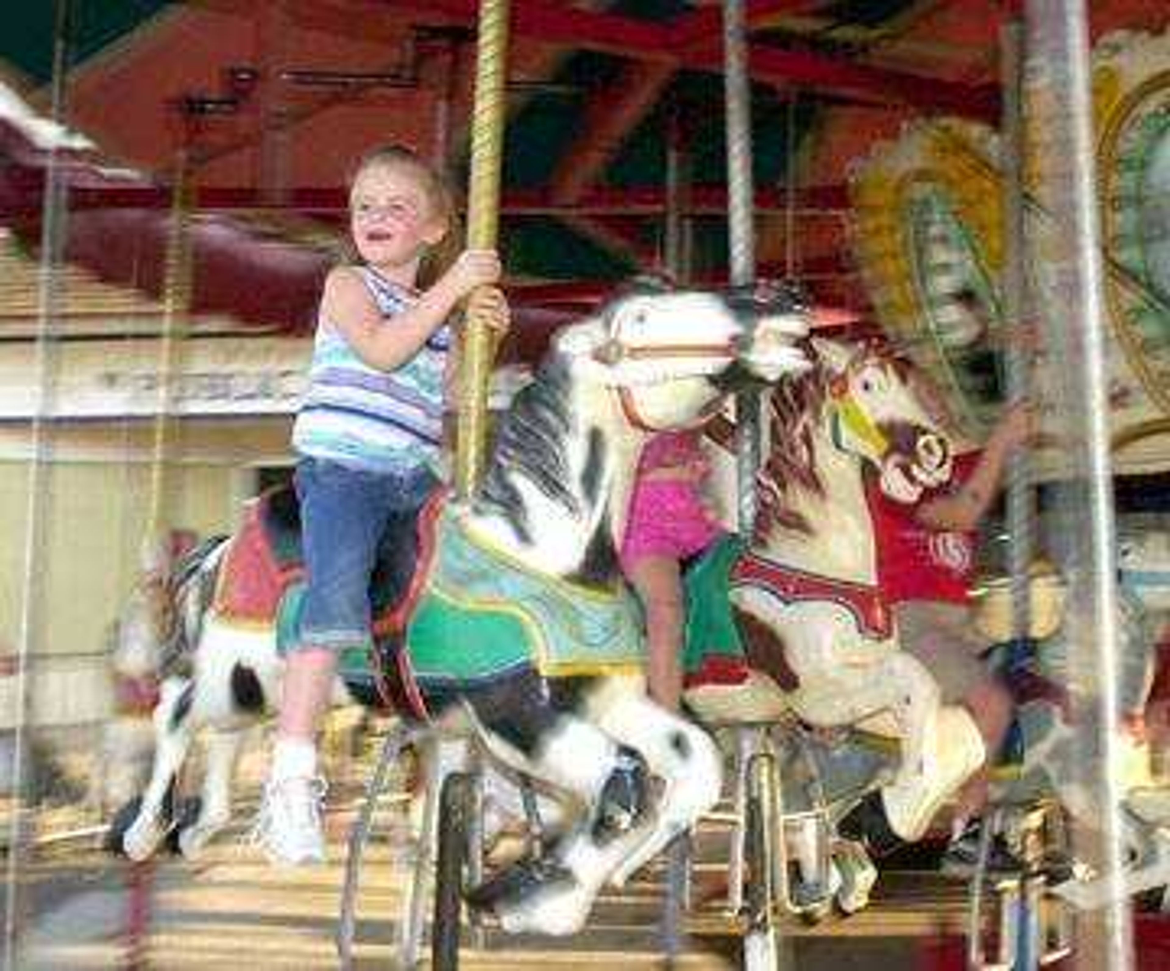 Abby Ballard, 5, enjoys her ride on the Merry Go Round during Wednesday's, Jackson Homecomers.