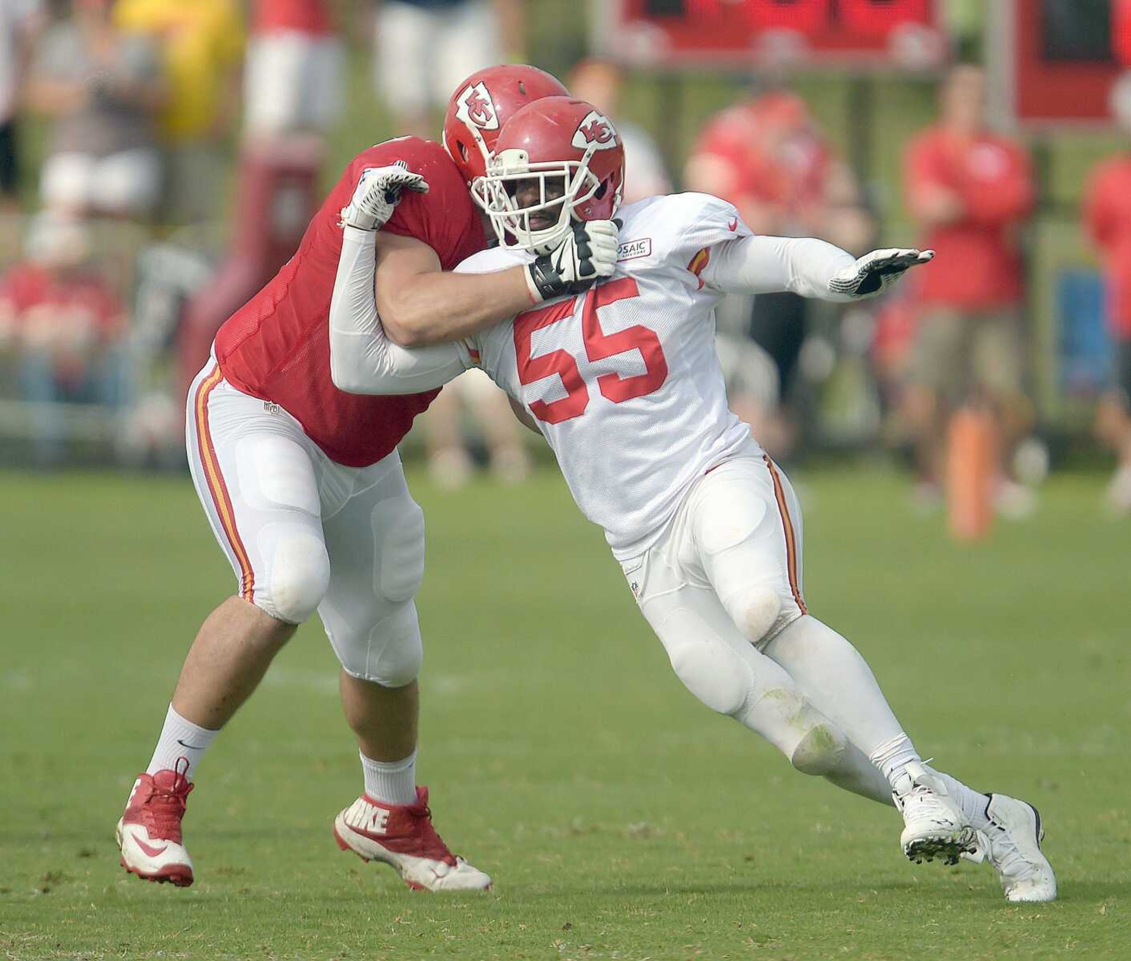 Kansas City Chiefs linebacker Dee Ford slips past Jeff Linkenbach during practice Monday morning on the Missouri Western State University campus in St. Joseph. Mo. (Todd Weddle ~ St. Joseph News-Press)