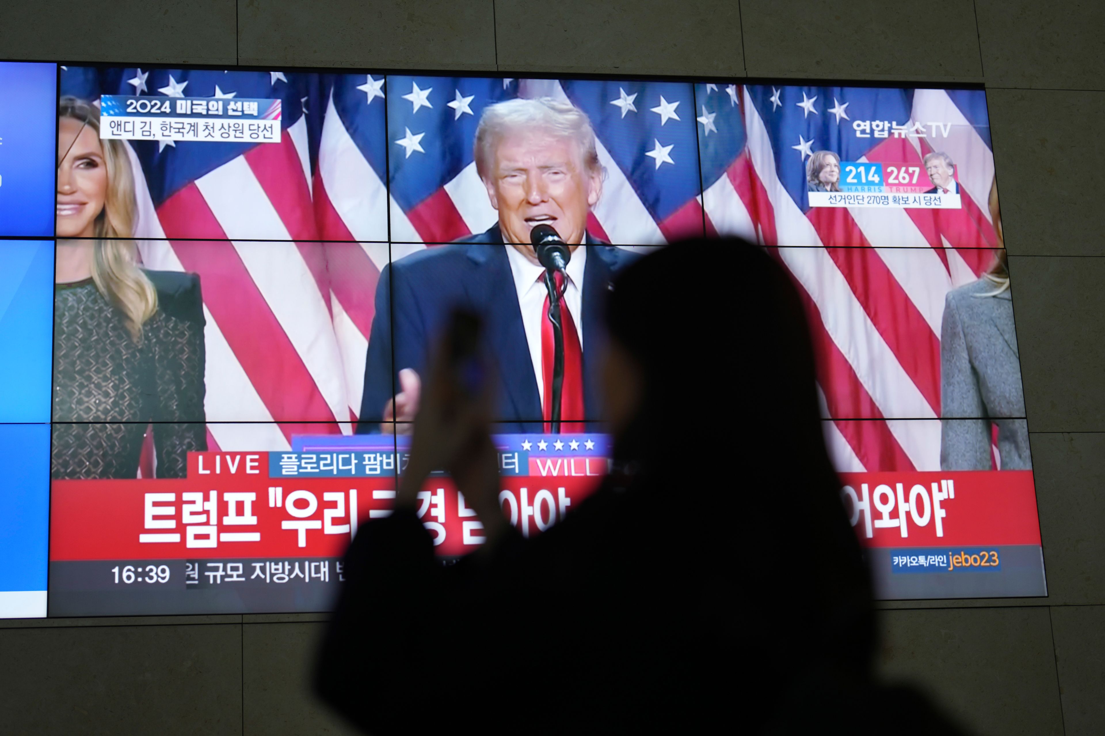 A screens shows live footage of Republican presidential nominee former President Donald Trump speech during a news program in Seoul, South Korea, Wednesday, Nov. 6, 2024. (AP Photo/Lee Jin-man)