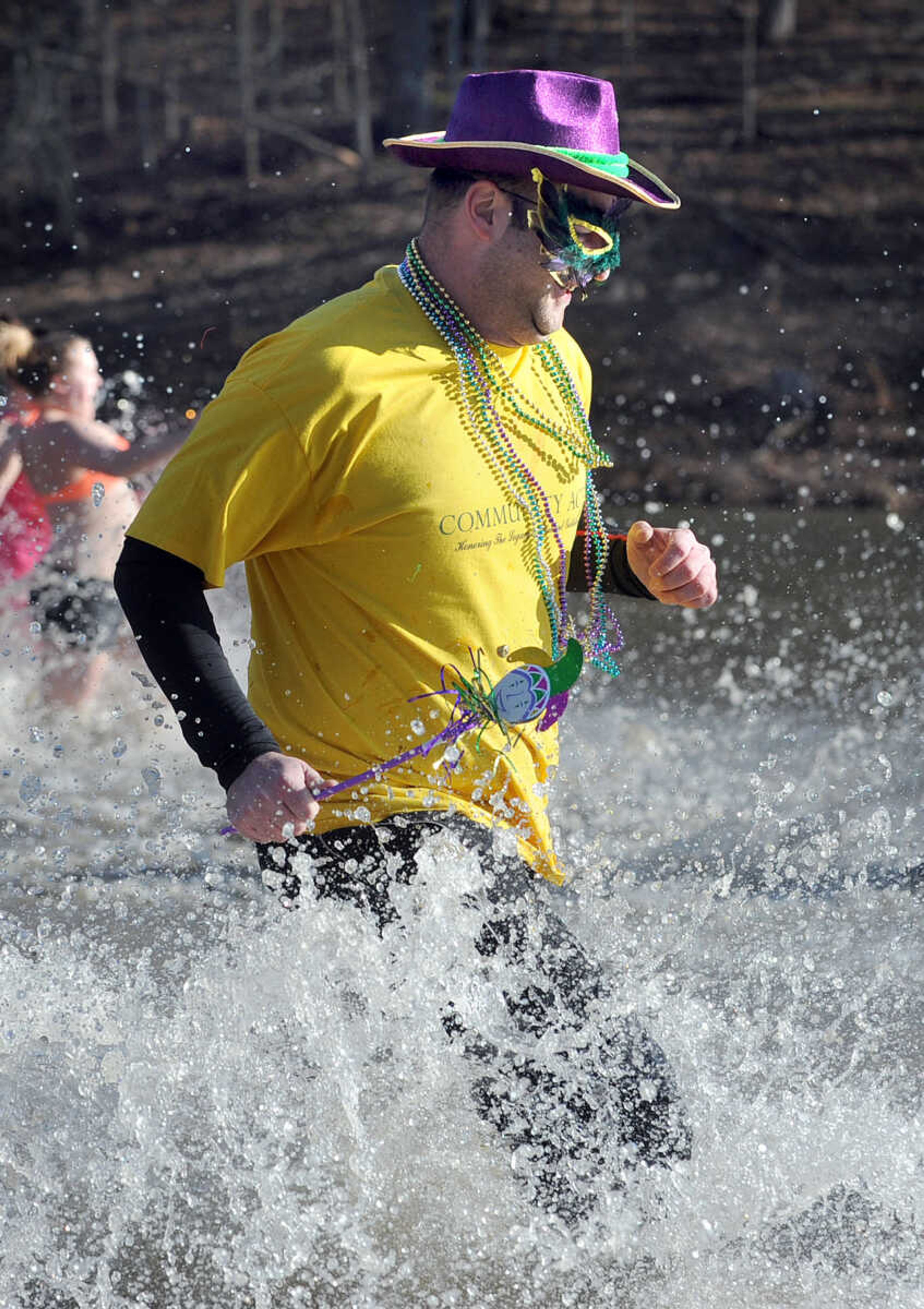 LAURA SIMON ~ lsimon@semissourian.com
People plunge into the cold waters of Lake Boutin Saturday afternoon, Feb. 2, 2013 during the Polar Plunge at Trail of Tears State Park. Thirty-six teams totaling 291 people took the annual plunge that benefits Special Olympics Missouri.