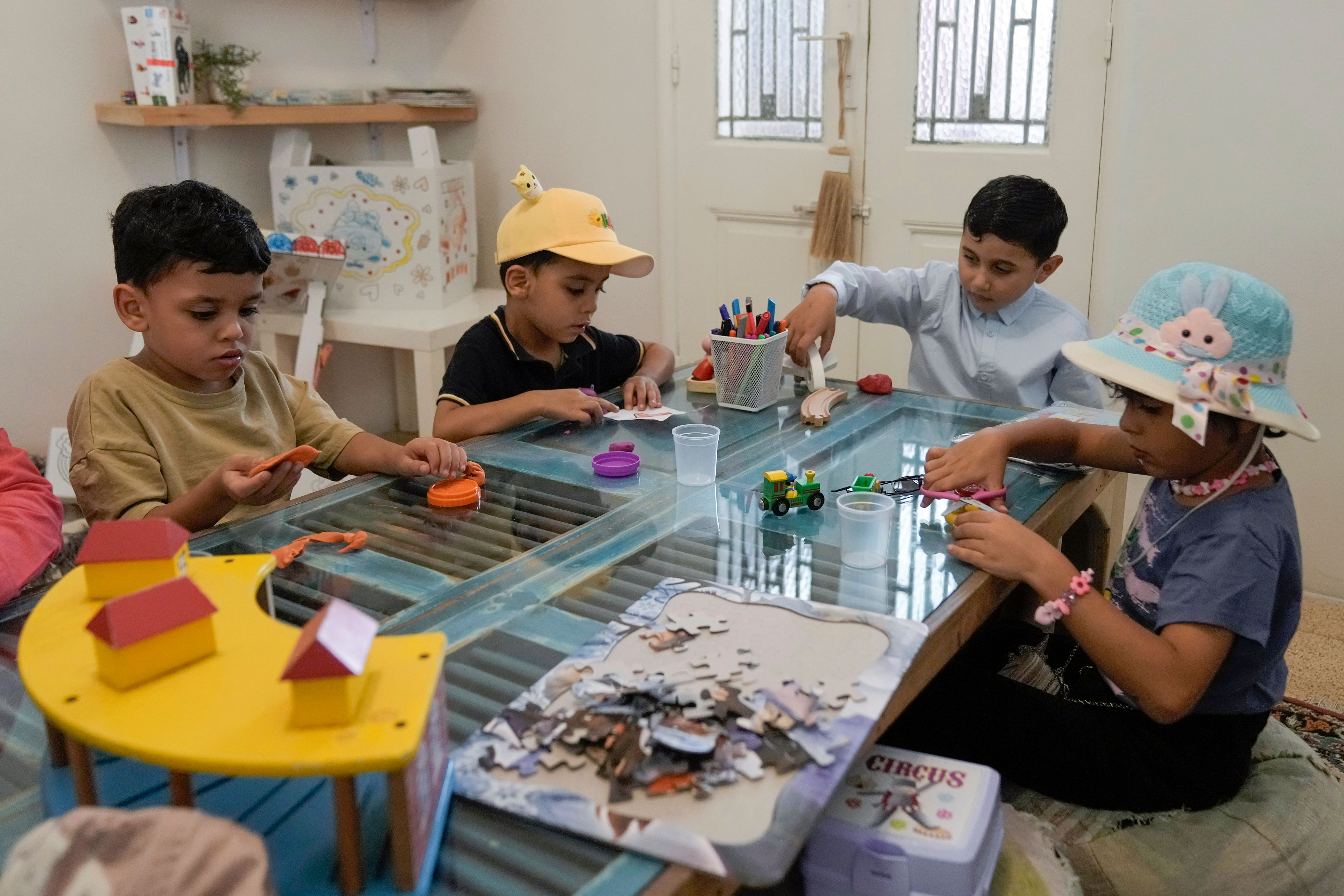 Palestinian children who were brought to Lebanon from the Gaza Strip for treatment, play at a summer camp in Beirut, Lebanon, Friday, Aug. 30, 2024. (AP Photo/Bilal Hussein)