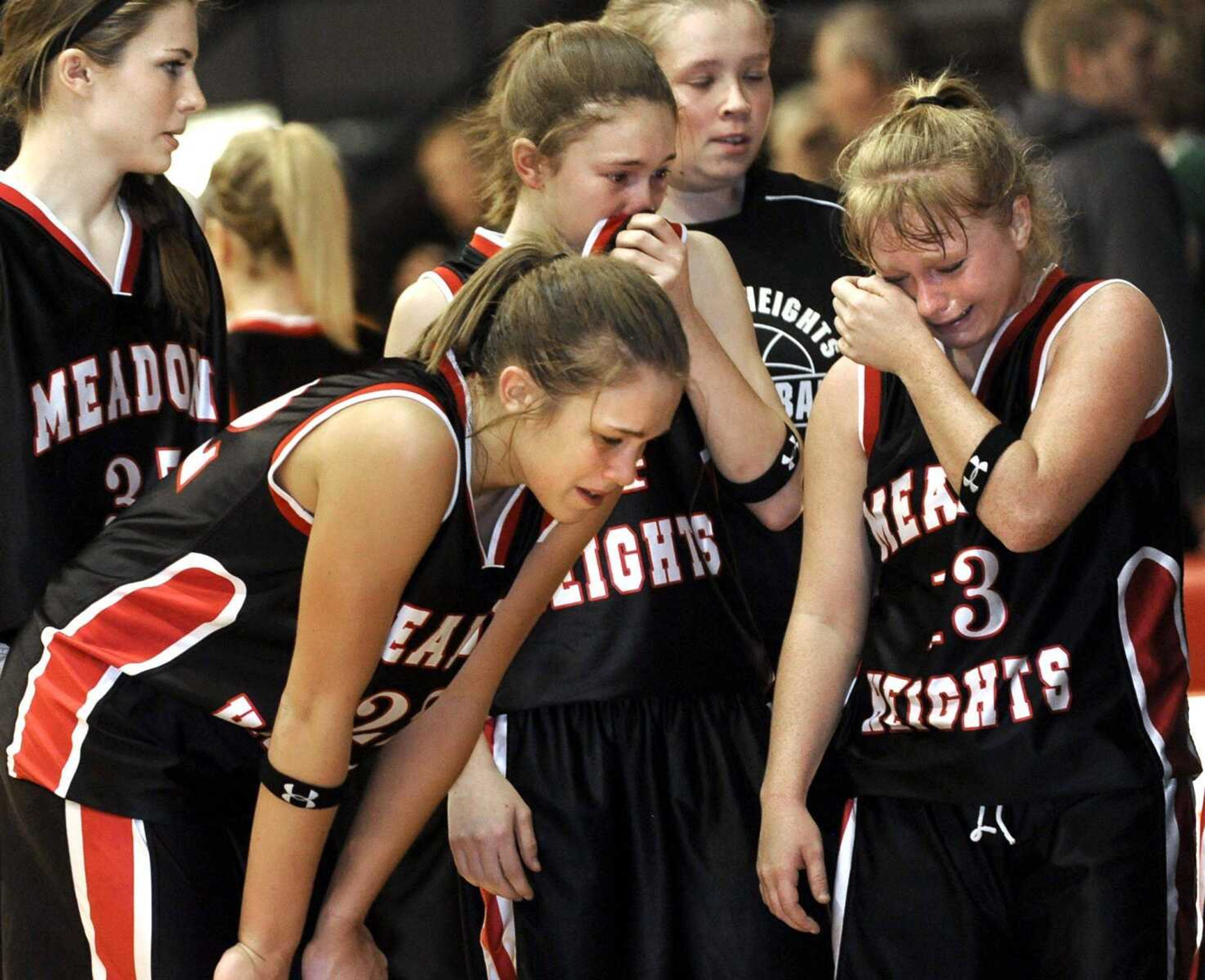 Meadow Heights players react to their 48-47 loss to New Haven in the Class 2 sectional game Wednesday in Park Hills, Mo. Check out more photos at semoball.com. (Fred Lynch)