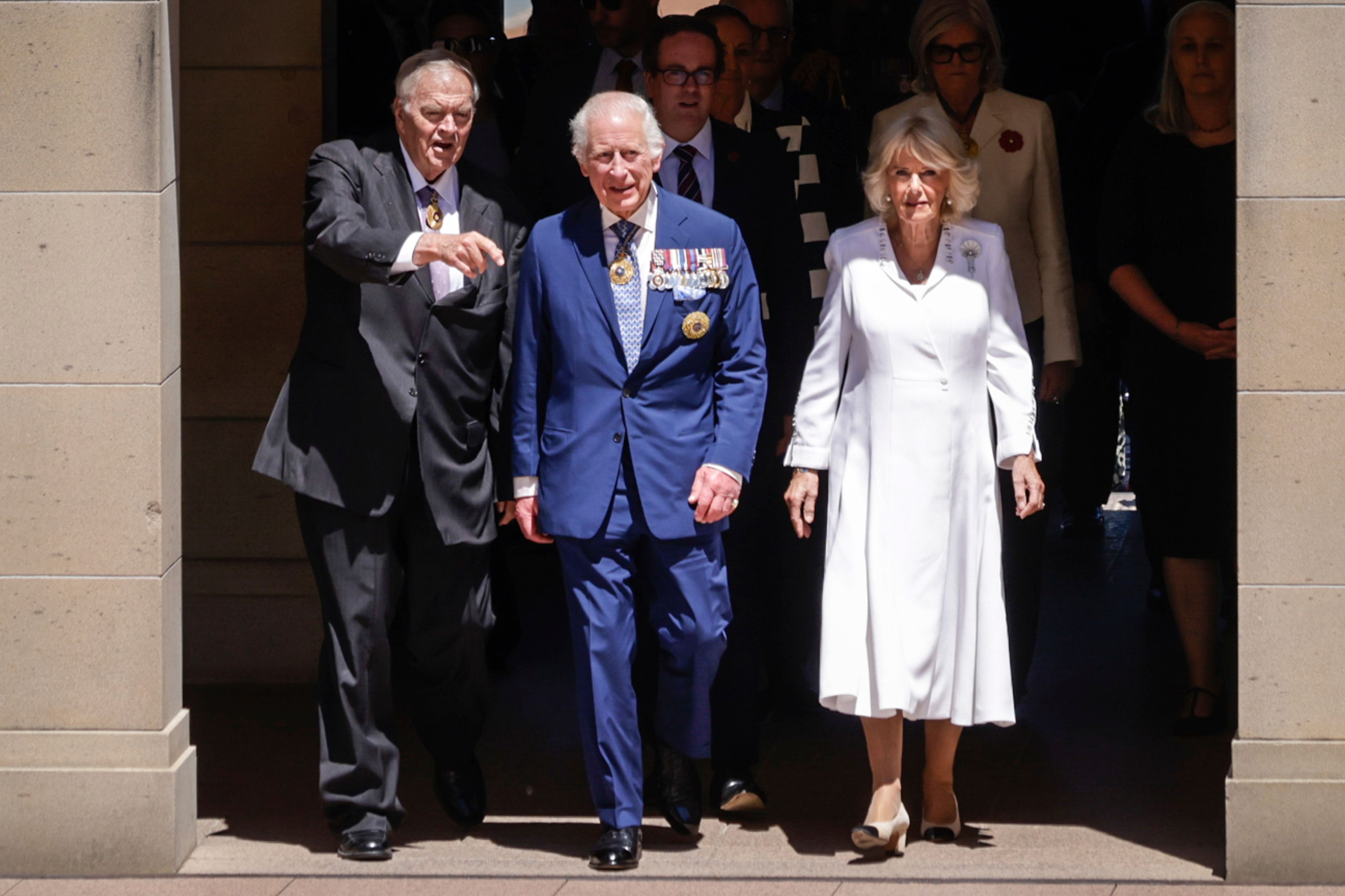 King Charles III and Queen Camilla arrive at the Australian War Memorial accompanied by Australian War Memorial Council Chair Kim Beazley, left, in Canberra, Australia, Monday, Oct. 21, 2024. (Brook Mitchell/ Pool Photo via AP)