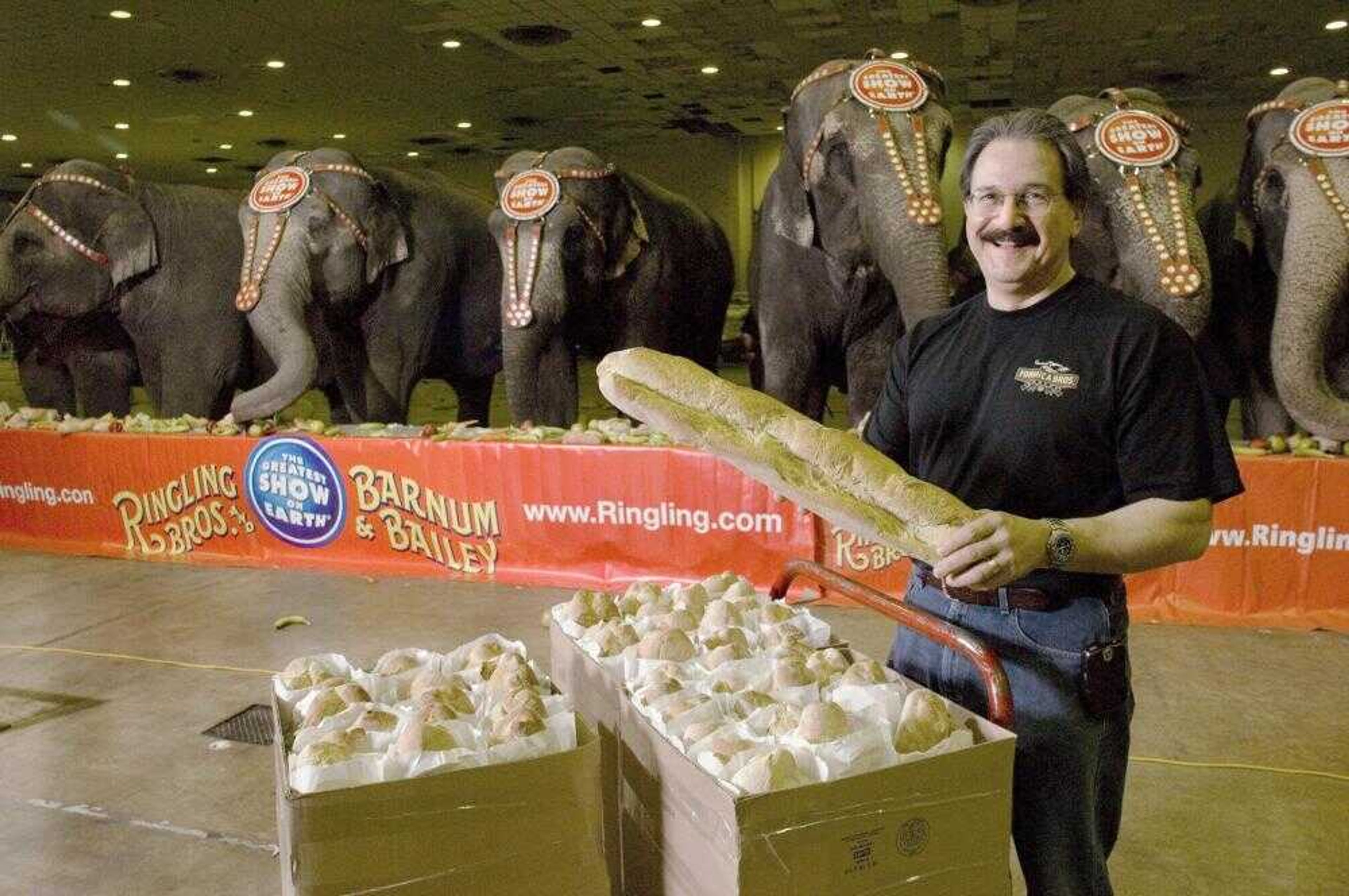 Frank Formica, of Formica Brothers Bakery, stood in Atlantic City, N.J., on Friday with a cart of the loaves of bread he baked for Ringling Bros. and Barnum &amp; Bailey Circus elephants. Formica expects to bake nearly 320 loaves of the special mixture bread for the 10 elephants during the circus' four-day stay. (COLIN ARCHER ~ Associated Press)