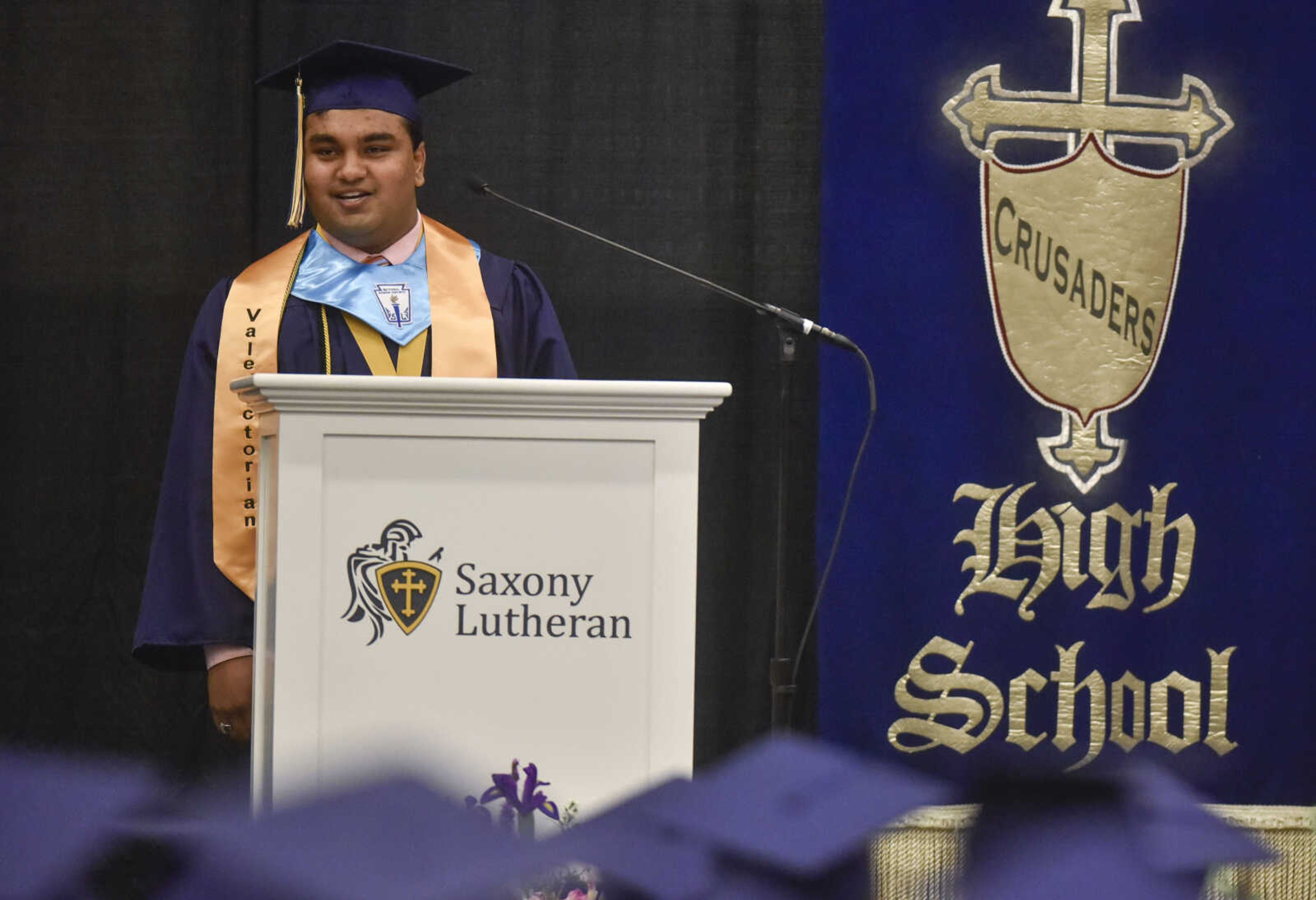 One of seven valedictorians, Jade Samanta delivers a valedictory address Sunday, May 20, 2018 at Saxony Lutheran High School in Jackson.