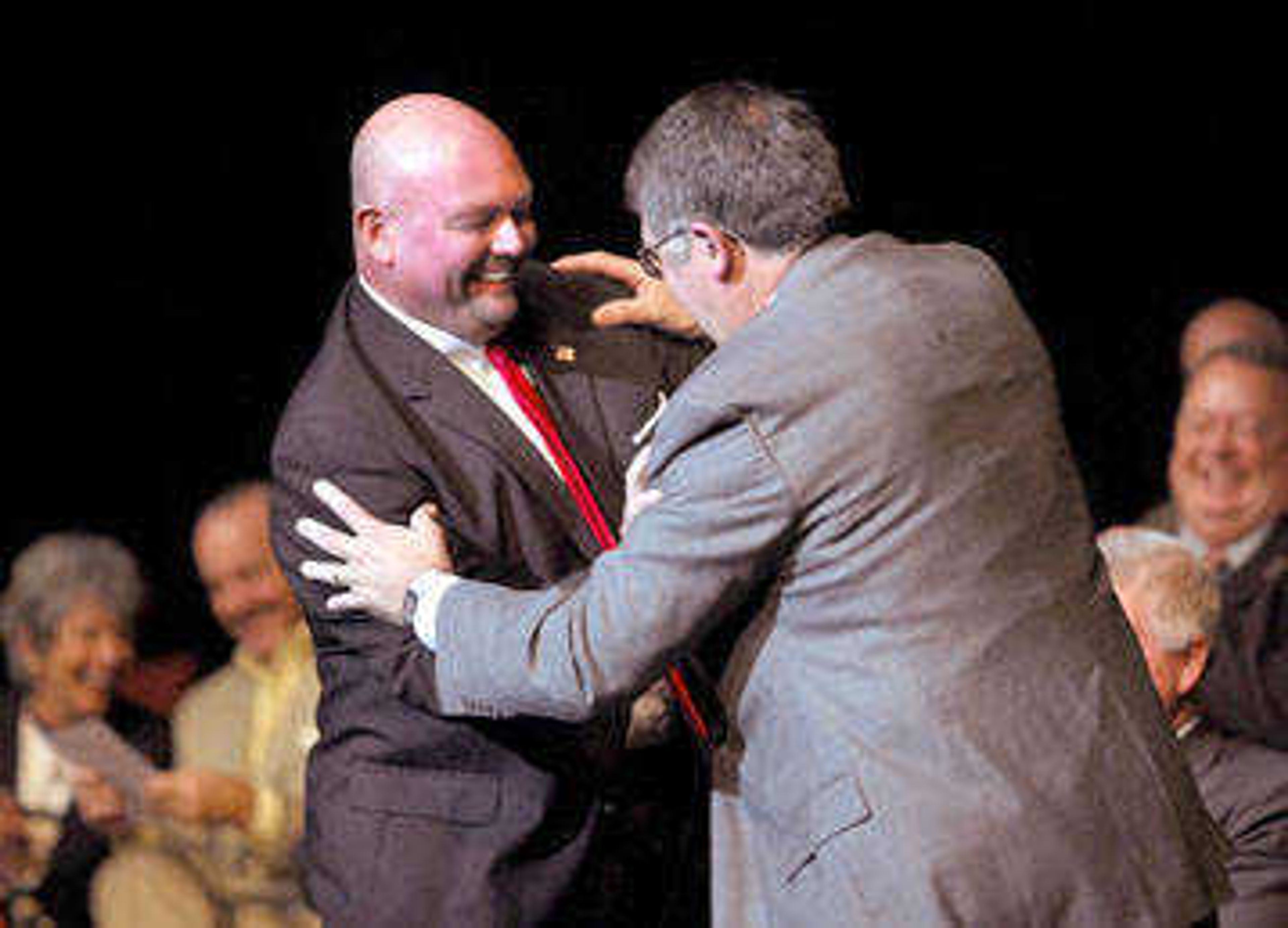 Cape Girardeau Mayor Jay Knudtson, left, demonstrated with Dr. Ken Dobbins, president of Southeast Missouri State University, that the city and university were dancing together with the completion of the River Campus.