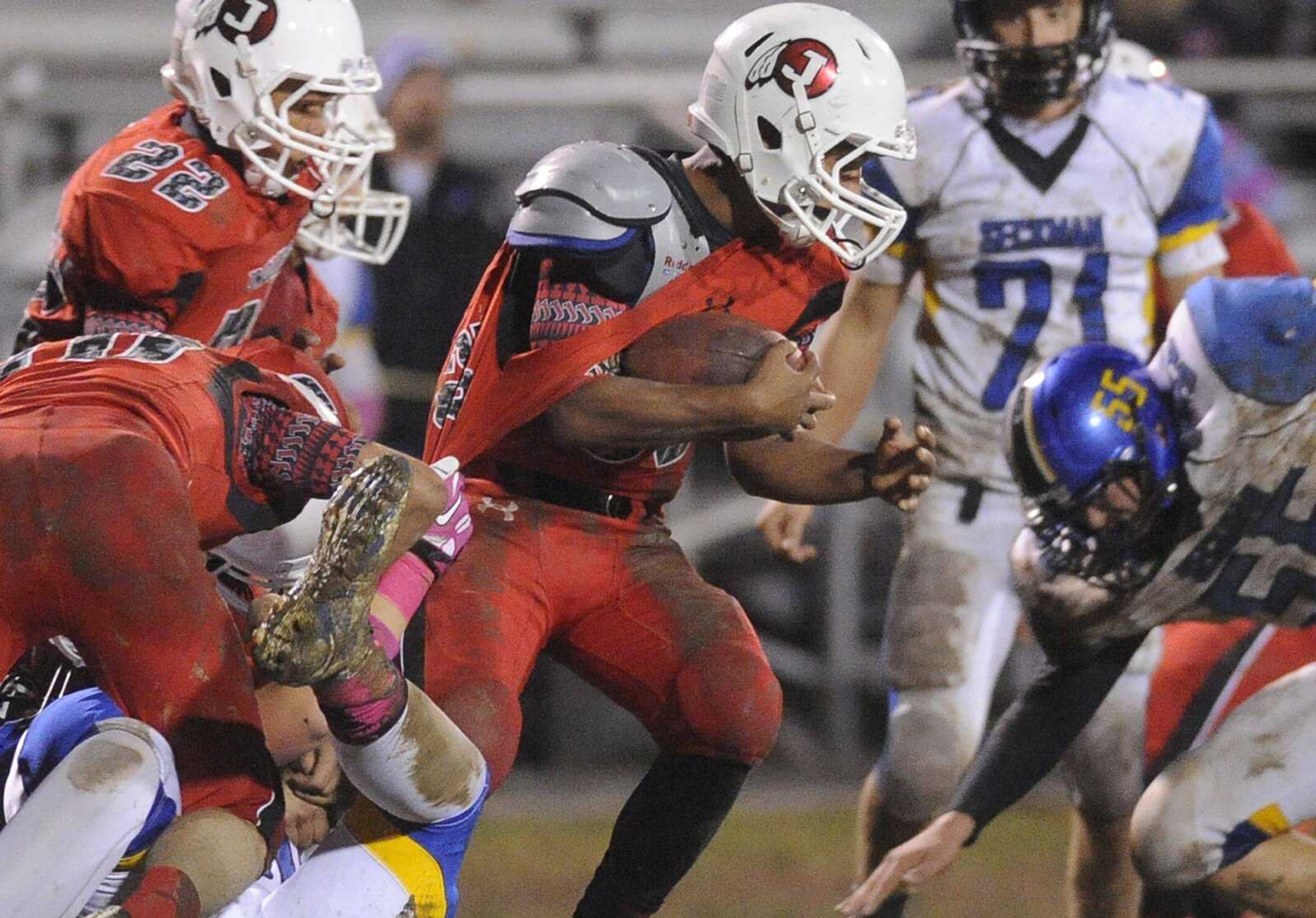 Jackson's Ethan Isaksen breaks a tackle after catching an interception in the second quarter against Seckman Friday, Oct. 10, 2014 in Jackson. (GLENN LANDBERG)