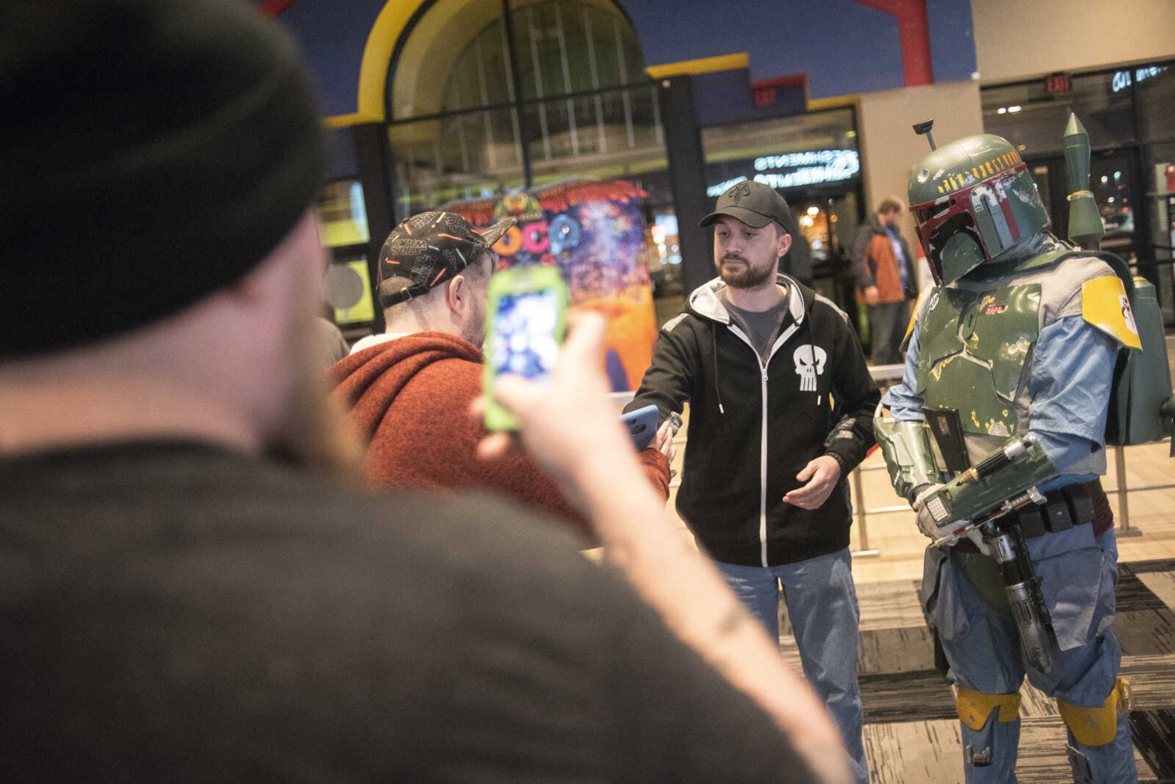 People take photos with characters of Star Wars before the showing of Star Wars: The Last Jedi Thursday, Dec. 14, 2017 at Cape West Cinema in Cape Girardeau.