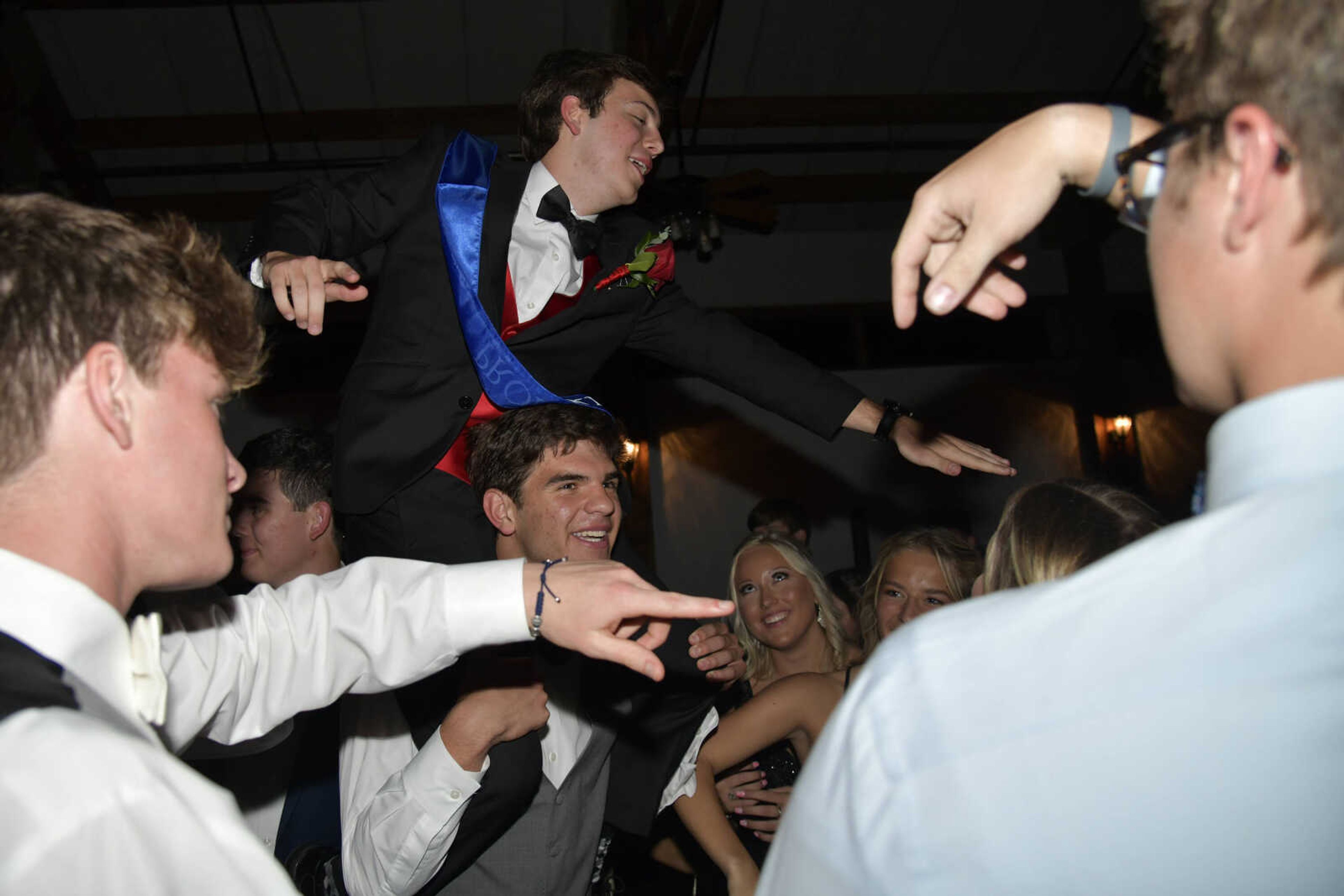 After being named prom king, Nick Williams dances while on Jake Young's shoulders during Notre Dame's prom at Bavarian Halle in Jackson on Friday, April 30, 2021.