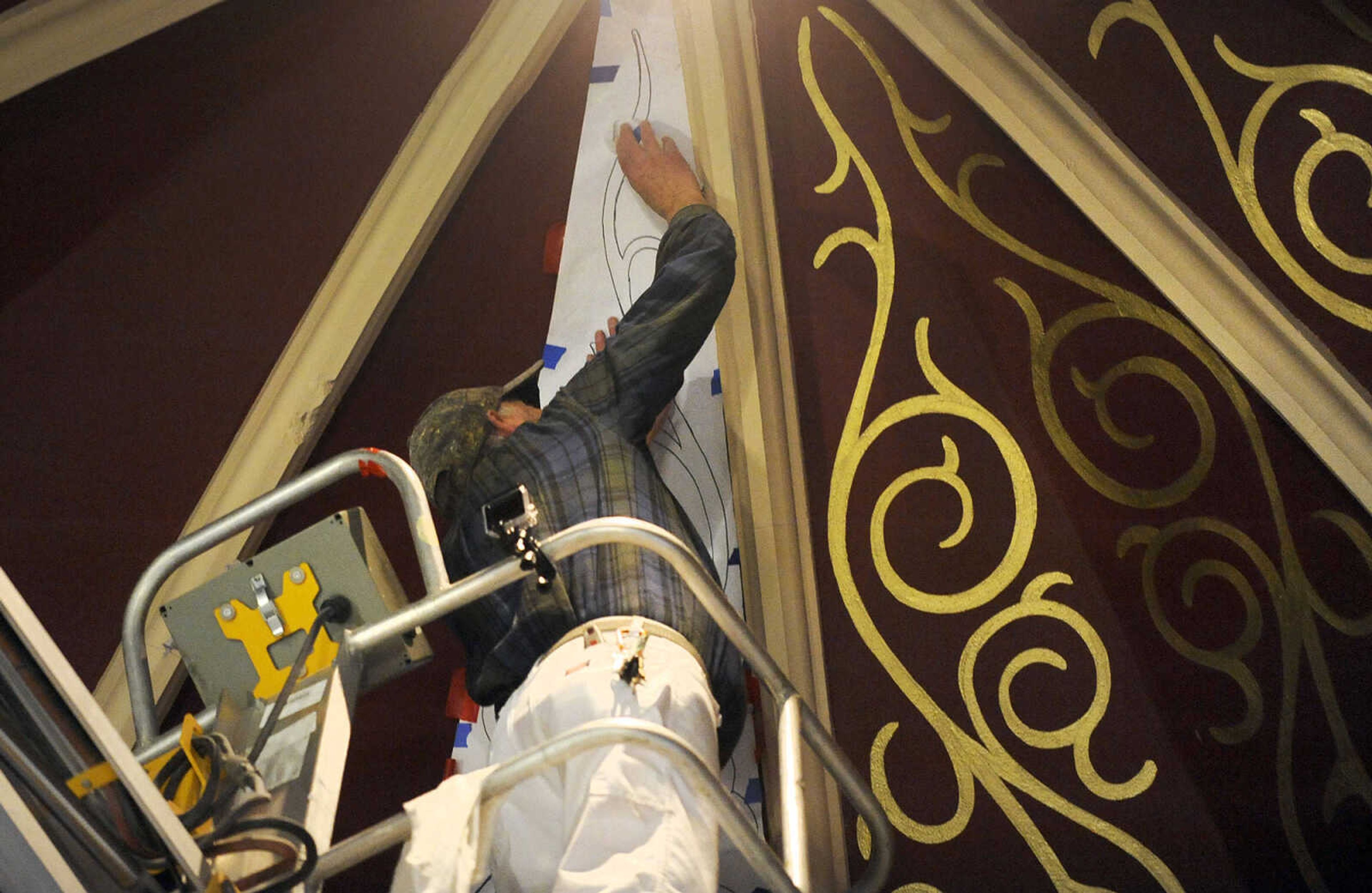 LAURA SIMON ~ lsimon@semissourian.com

Gary West taps chalk over the stencil he created for the ceiling above the tabernacle at St. John's Catholic Church in Leopold, Missouri on March 4, 2016.