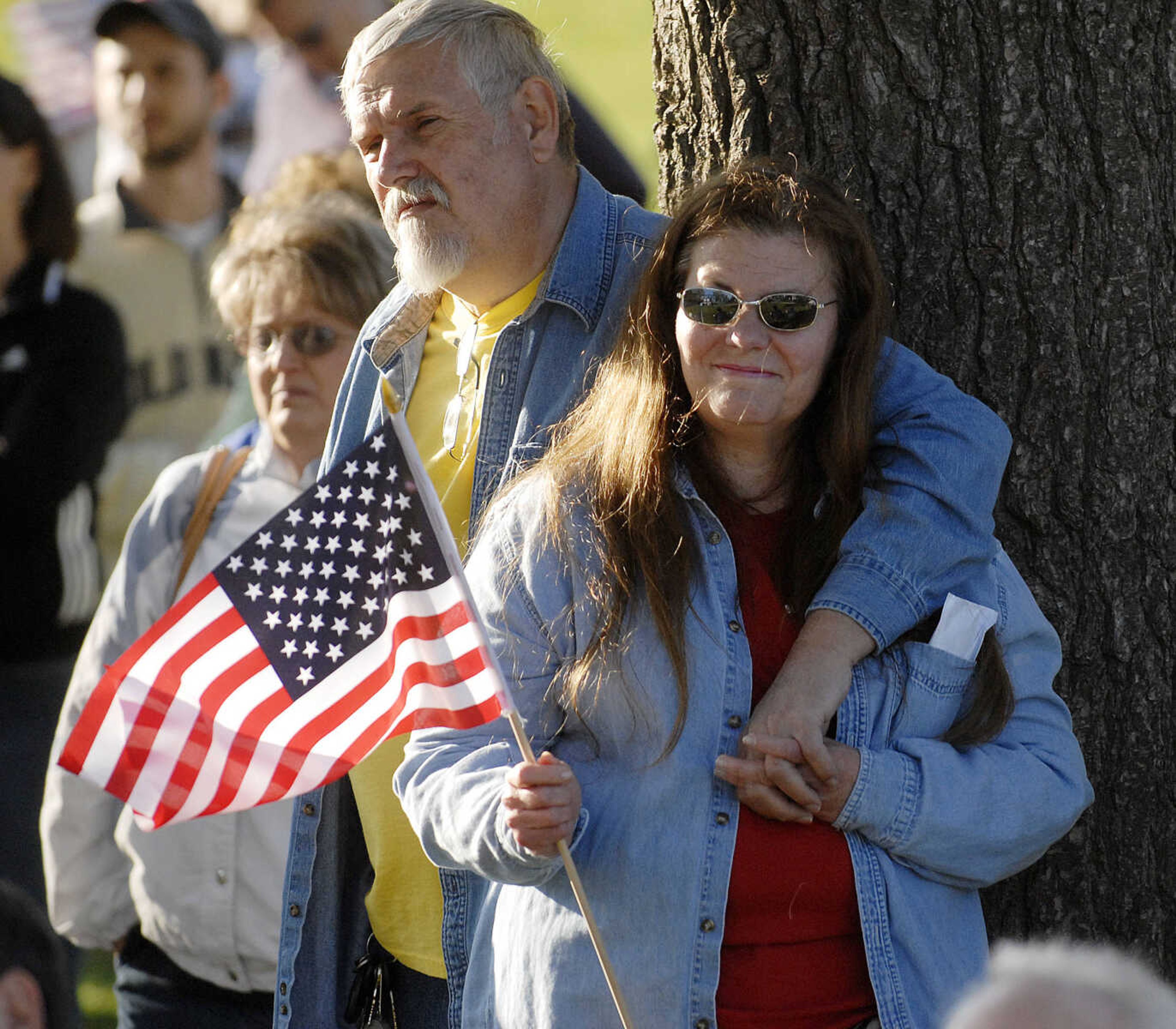 ELIZABETH DODD ~ edodd@semissourian.com
Johnnie Haupt of Fruitland, left, and his wife Kathie listen to speakers at a "tea party" tax protest at Capaha Park Wednesday.