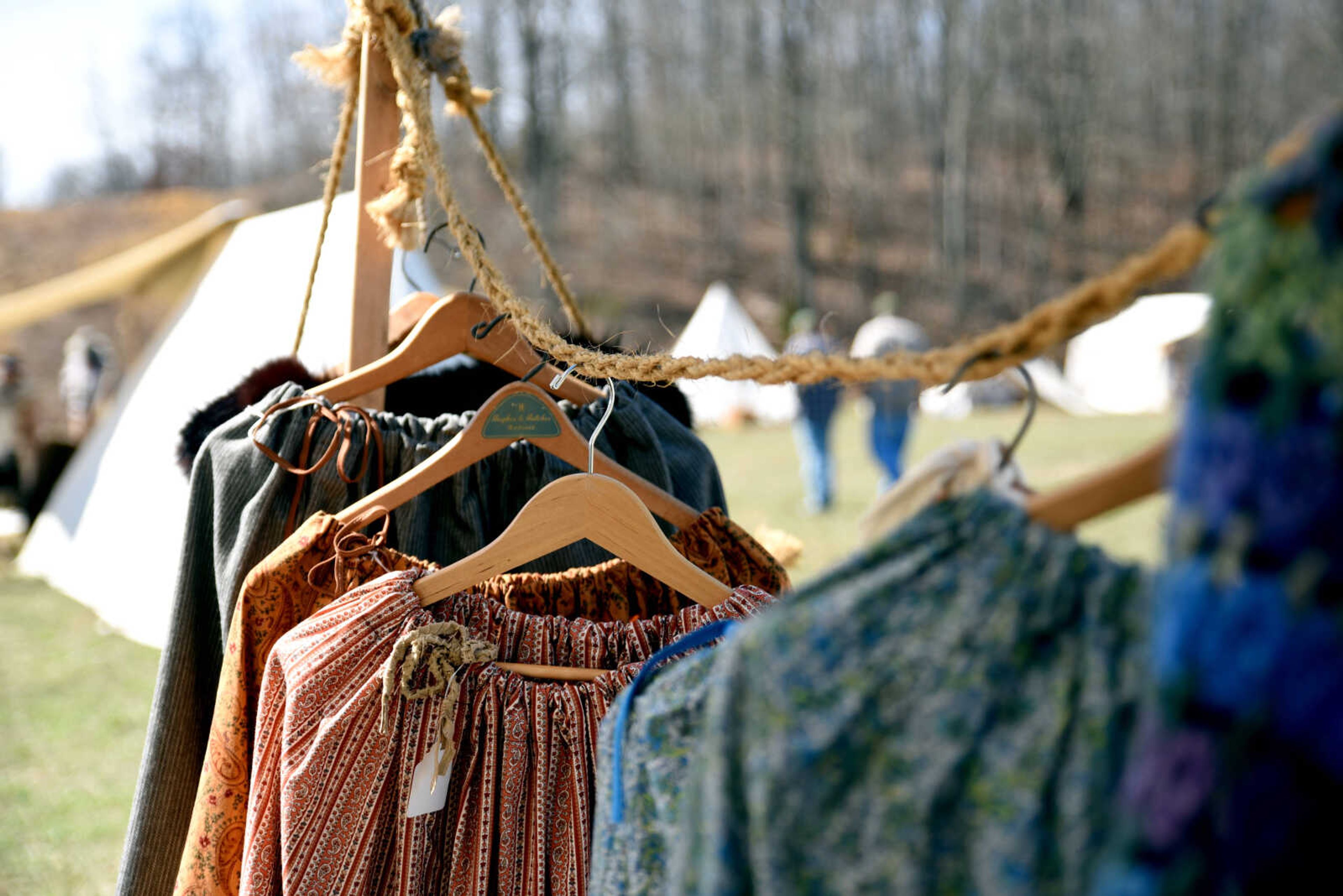 Clothes hang for sale at Cindy Barnes' tent during the second annual Eastern Ozark Rendezvous held at Bark's Planation Saturday, March 17, 2018, in Glenallen.