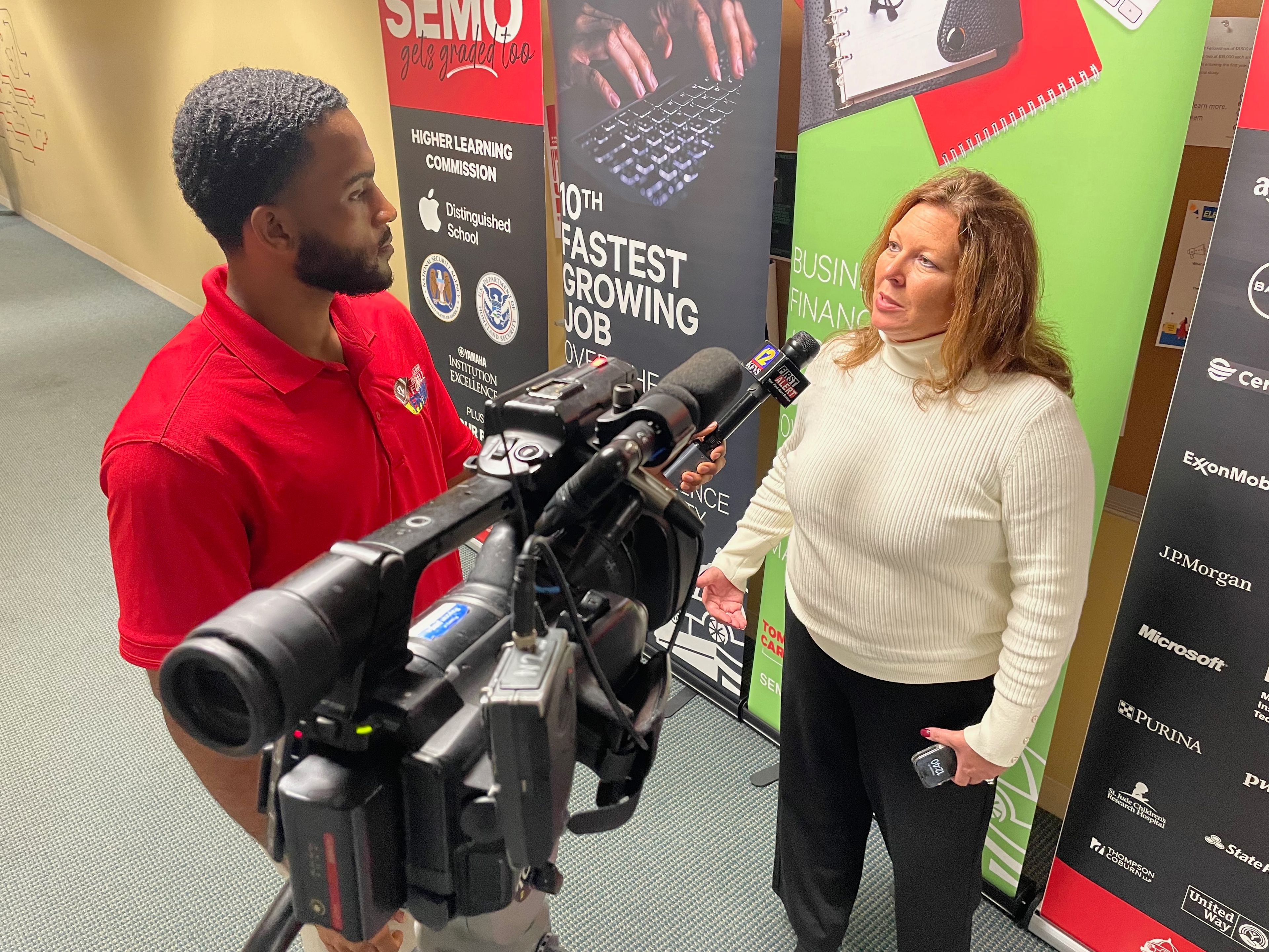 IBM’s Missouri senior state executive Melissa Long Dolson is interviewed by a SEMO student. She told the Southeast Missourian: “The Cyber Range will help prepare the students with immersive hands-on training and simulation programs that replicate real-life attacks. This is going to empower our students to hone those capabilities and safeguard people and organizations as they move forward in their careers. This work will provide critical real-world experience for SEMO students to develop the skills so they can excel in the cybersecurity field, and it's going to help us close that cybersecurity workforce gap that we have.”