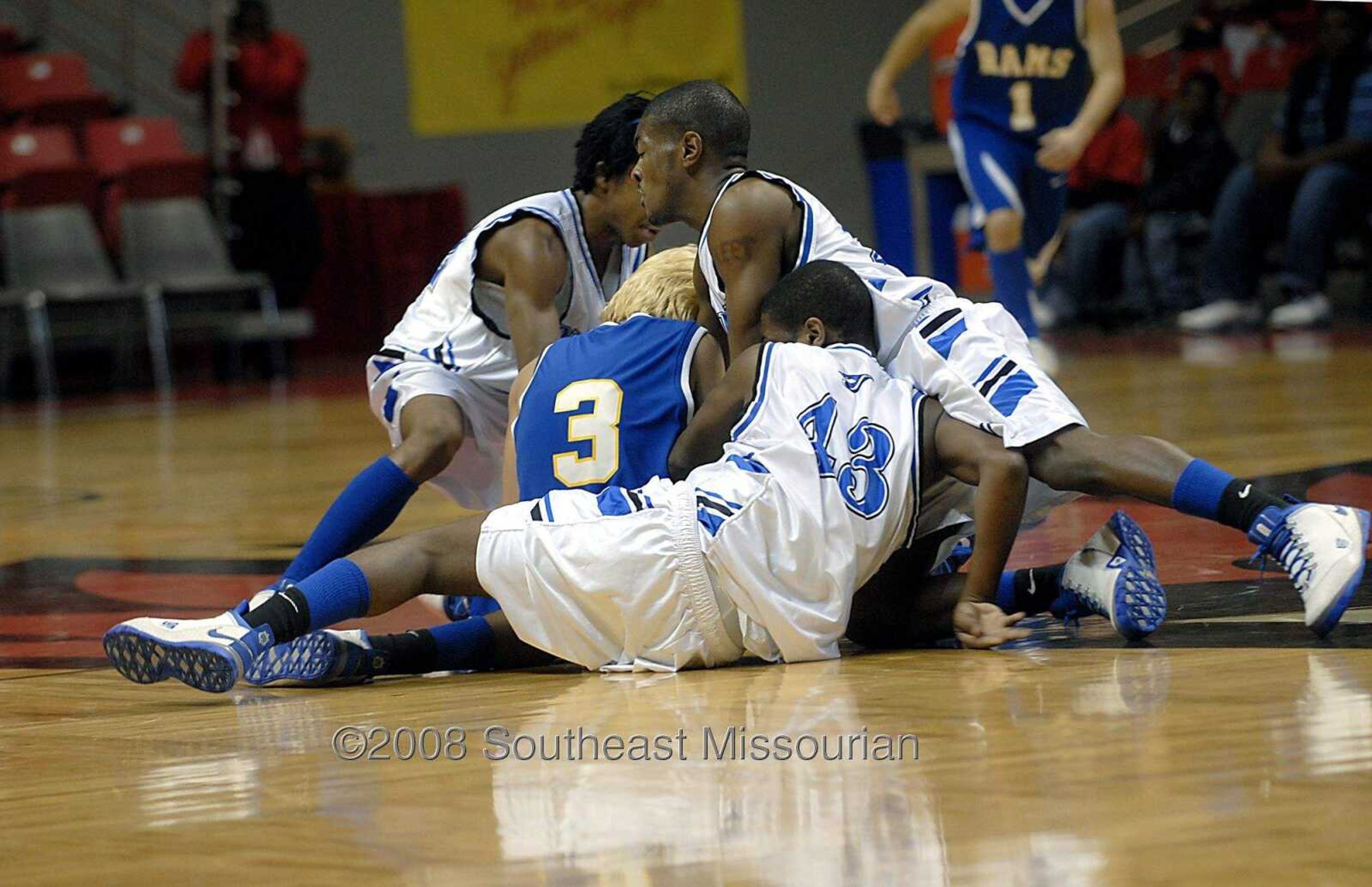 KIT DOYLE ~ kdoyle@semissourian.com
Charleston players swarm around Scott City's Skylar Cobb (3) as they all go for a loose ball Friday, December 26, 2008, in the first round of the Southeast Missourian Christmas Tournament at the Show Me Center.