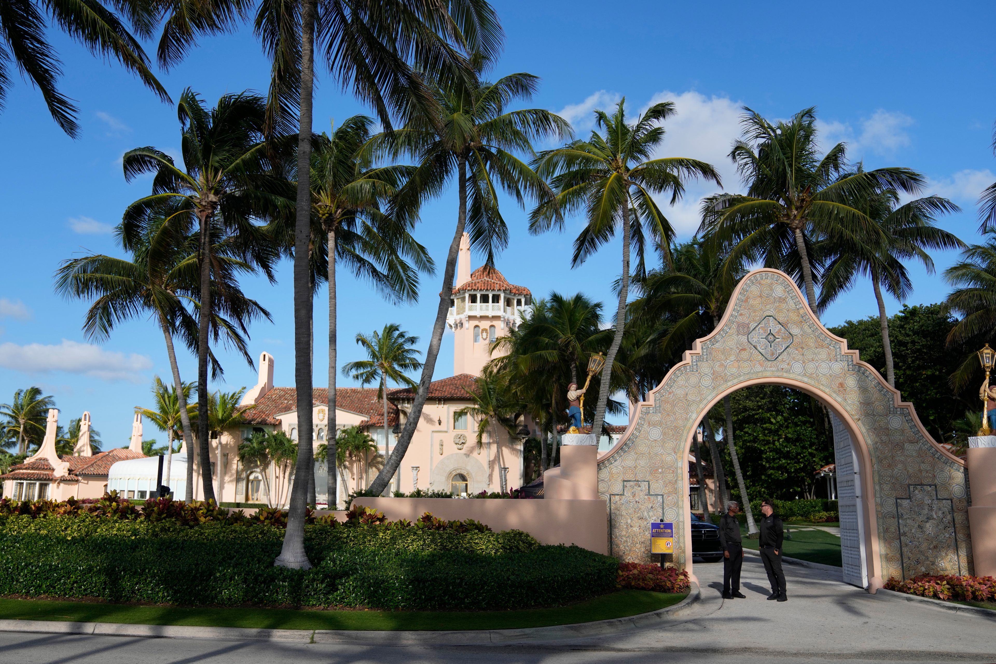 FILE - Security agents talk at the entrance to former President Donald Trump's Mar-a-Lago estate, March 31, 2023, in Palm Beach, Fla. (AP Photo/Rebecca Blackwell, File)