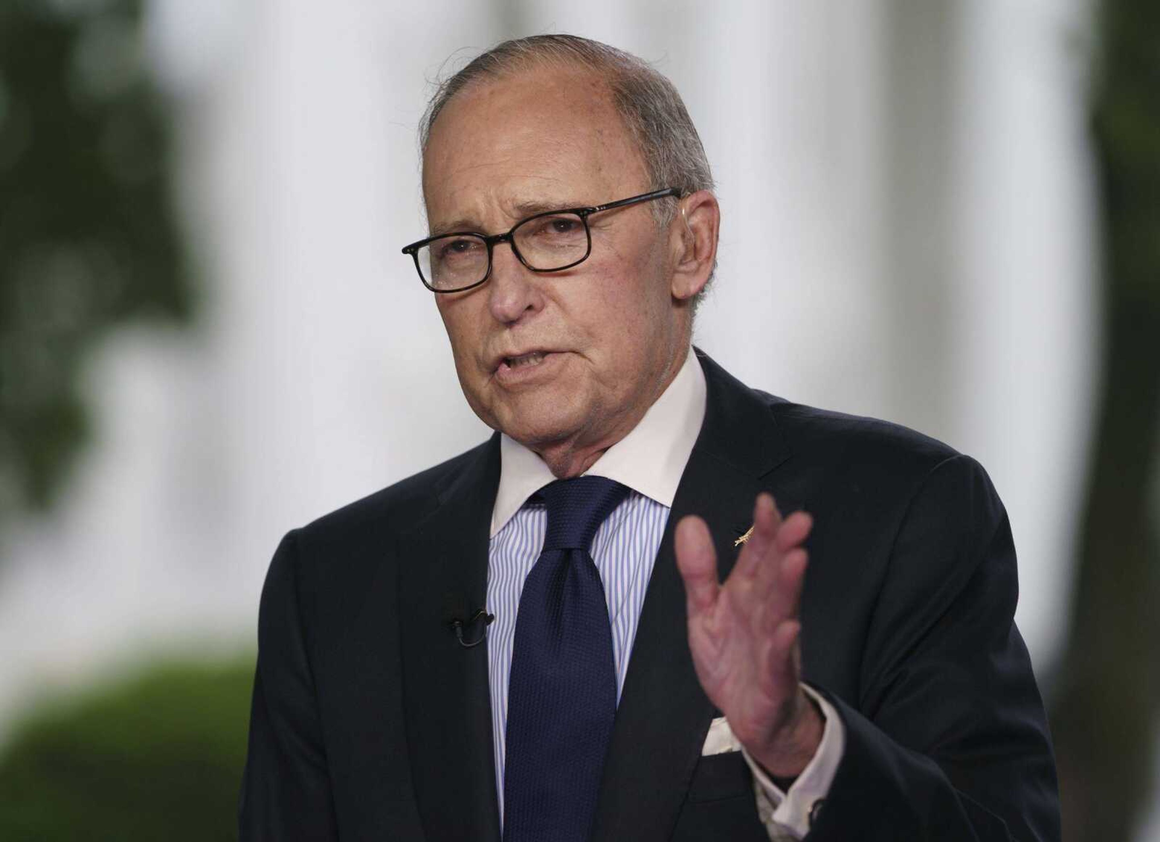 White House chief economic adviser Larry Kudlow speaks during a television interview outside the West Wing of the White House in Washington. President Donald Trump's top economic adviser said the president now prefers to negotiate separately with Canada and Mexico over their three-country trade deal.