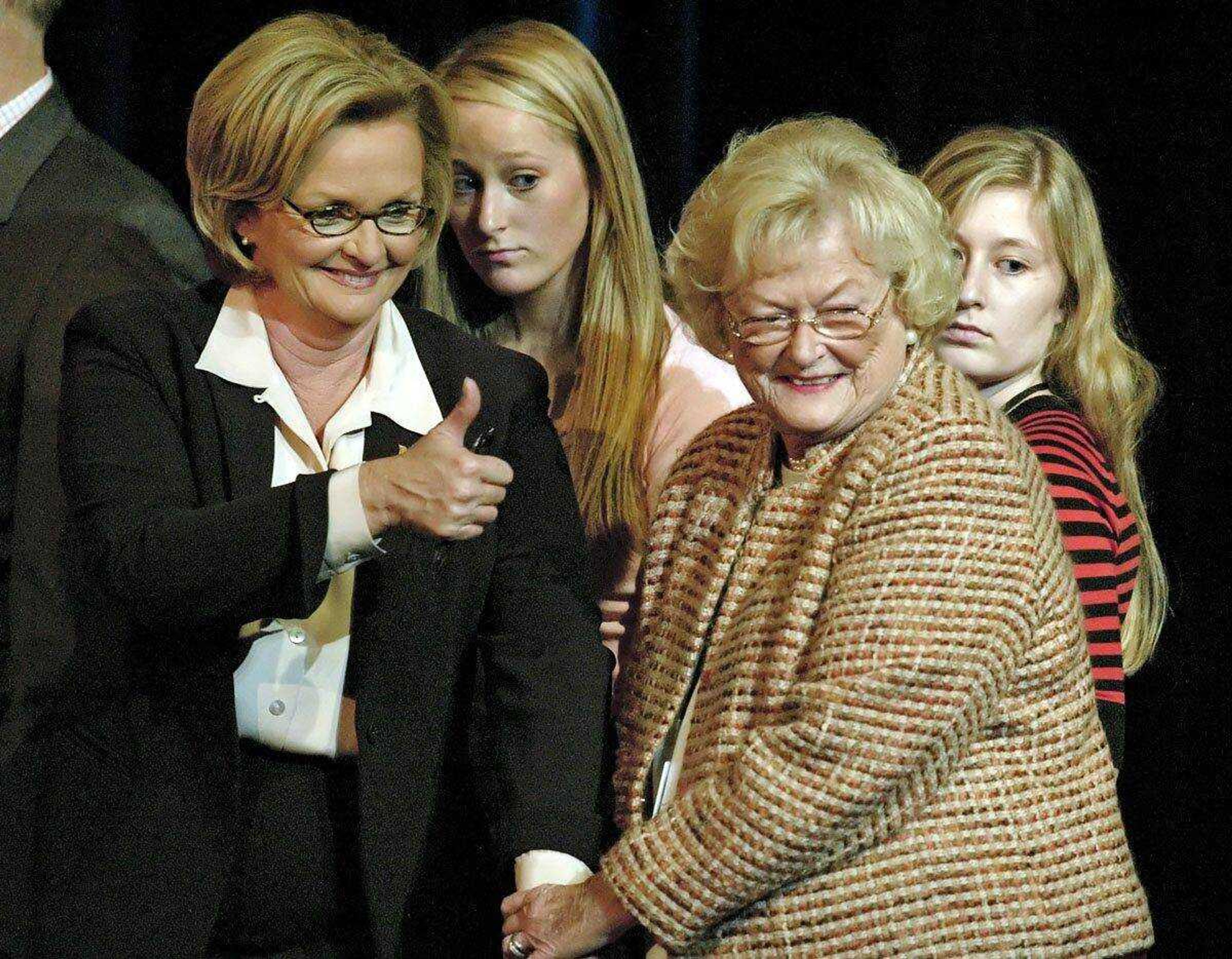 Then-candidate for U.S. Senate Claire McCaskill, left, gives the thumbs up to supporters as she holds the hand of her mother, Betty Anne McCaskill, after her debate against incumbent Sen. Jim Talent Oct. 11, 2006 at Clayton high school in Clayton, Mo. (Associated Press file)