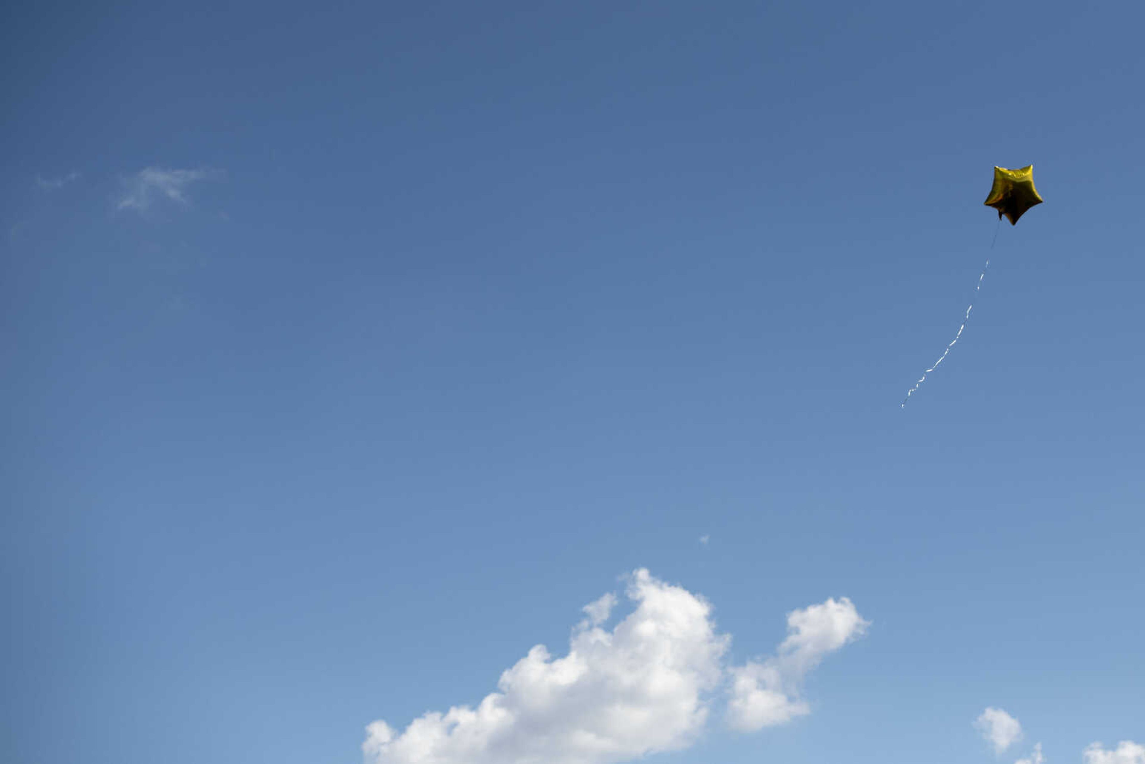 A balloon drifts in the air during a drive-through graduation ceremony Saturday, June 13, 2020, at Cape Girardeau Central High School in Cape Girardeau.