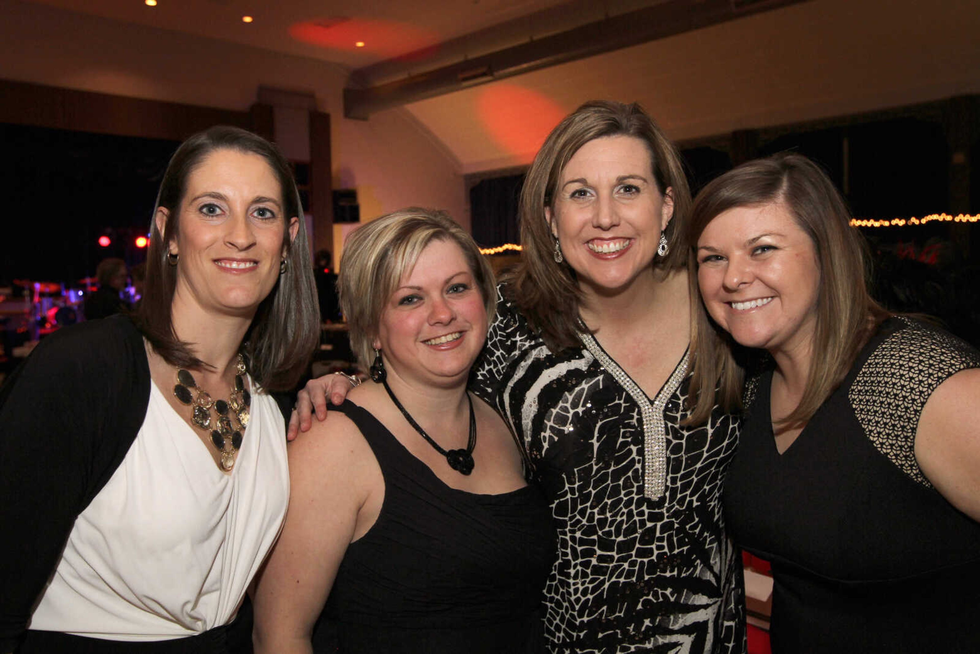 GLENN LANDBERG ~ glandberg@semissourian.com


Shelly Weber, left, Samantha Trankler, Shauna Criddle and Lauren Skelton pose for a photo during the Red and Black Affair benefit for the Jackson R-2 Foundation Saturday, Feb. 7, 2015 at the Arena Building.