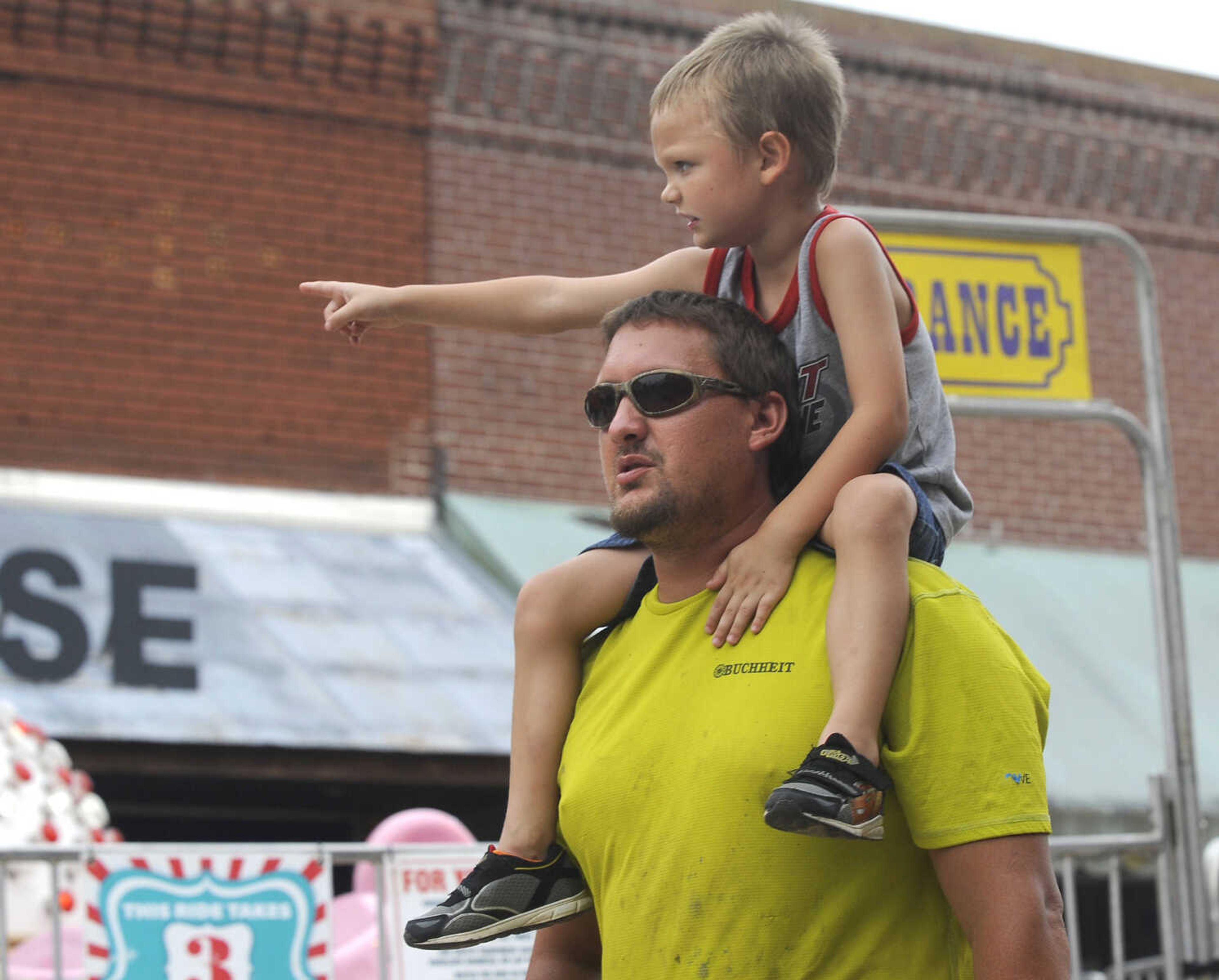 FRED LYNCH ~ flynch@semissourian.com
Alex Lix points out the next stop to his father, Ethan Lix, the "super truck" ride Wednesday, July 26, 2017 at Homecomers in Jackson.