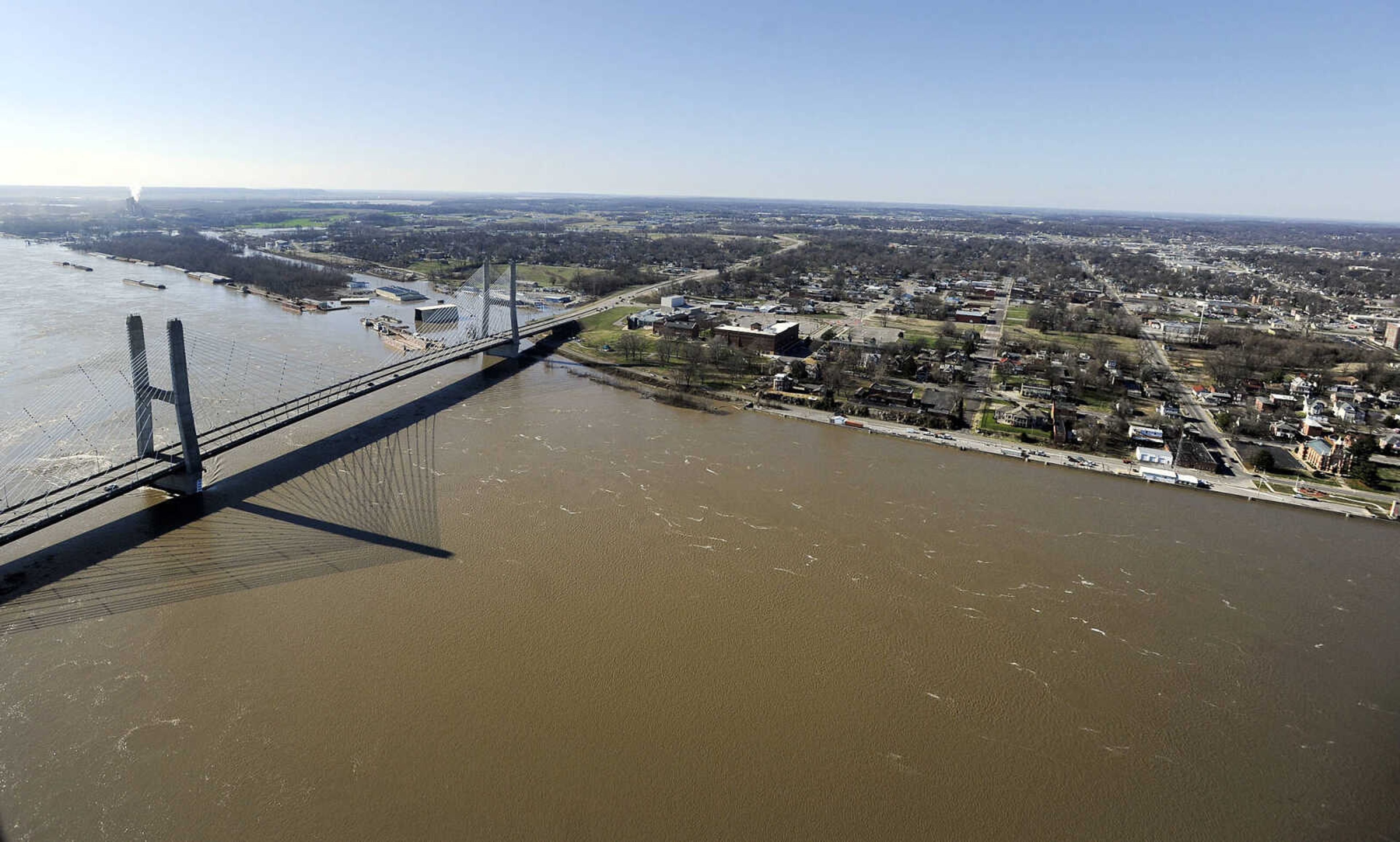 LAURA SIMON ~ lsimon@semissourian.com

The swollen Mississippi River is seen flowing under the Bill Emerson Memorial Bridge in Cape Girardeau, Saturday, Jan. 2, 2016.