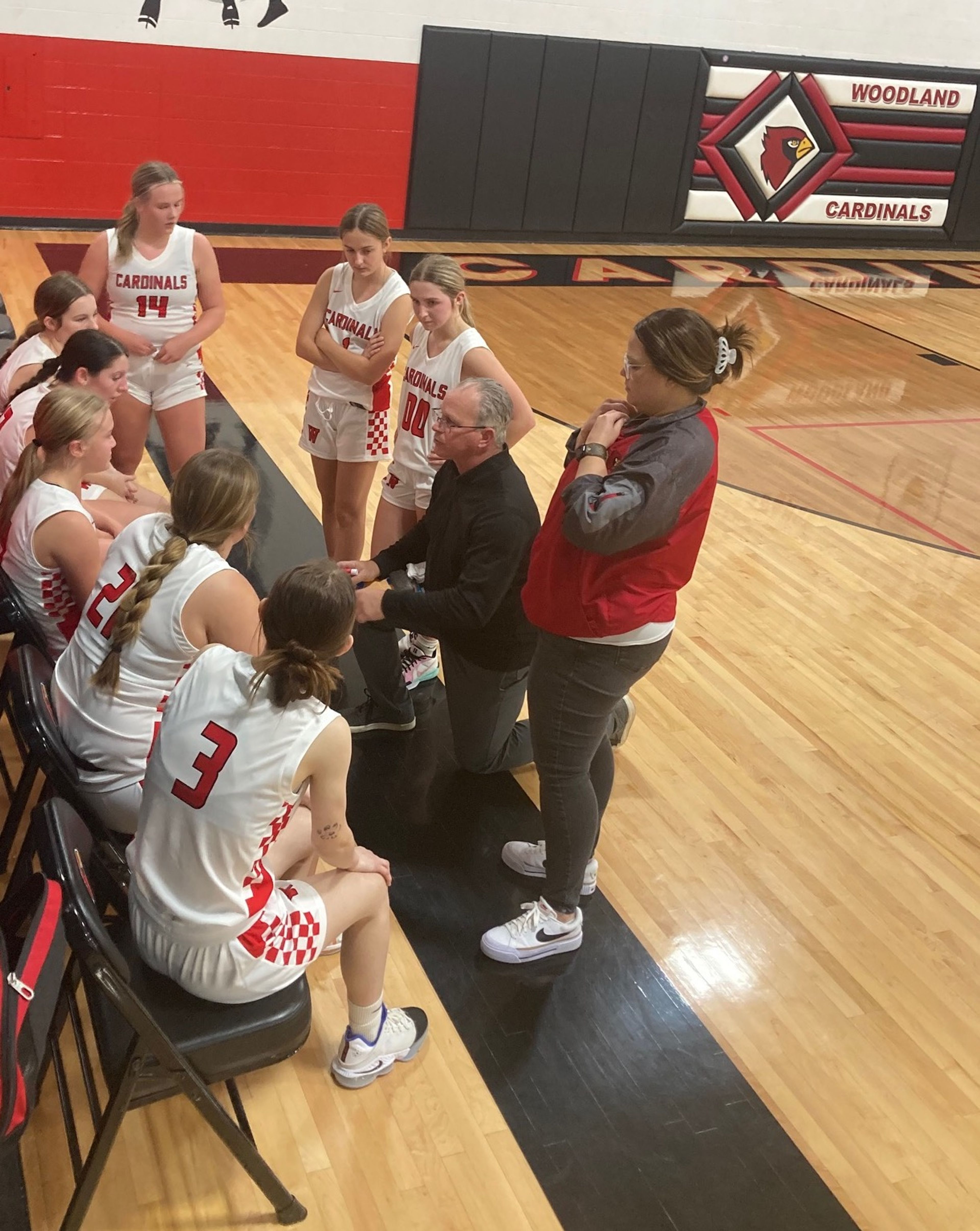 Woodland girls basketball coach Paul Lynch gives instruction during a timeout in Monday's home win over Bloomfield.