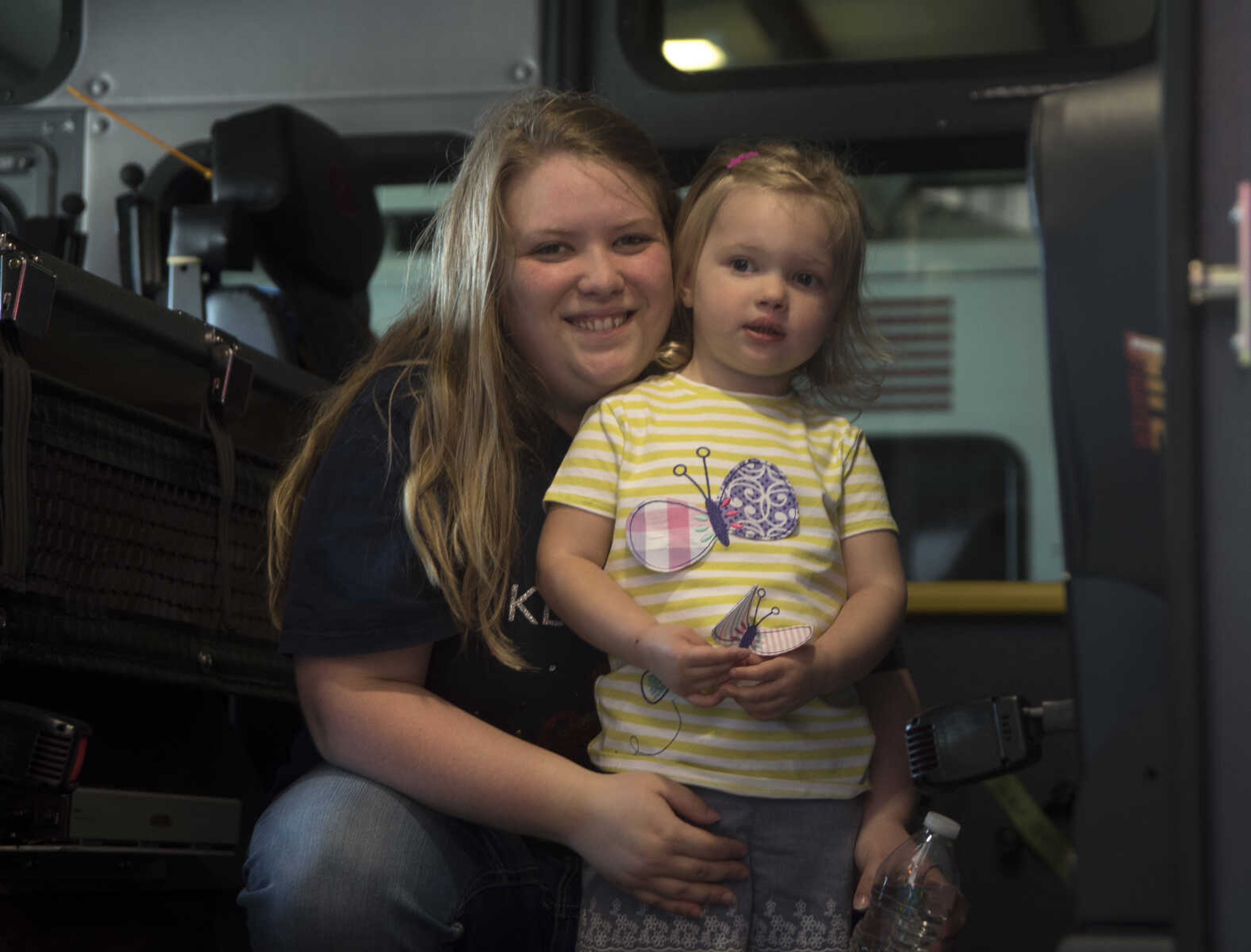 Tabitha Grovenor and Terra Grovenor pose for a photo during the showing of the six Cape Girardeau fire trucks purchased at fire station number two Saturday, April 15, 2017 in Cape Girardeau. The National Fire Protection Association recommends fire departments to rotate their fleet every 10 years costing approximately $3.8 million dollars.