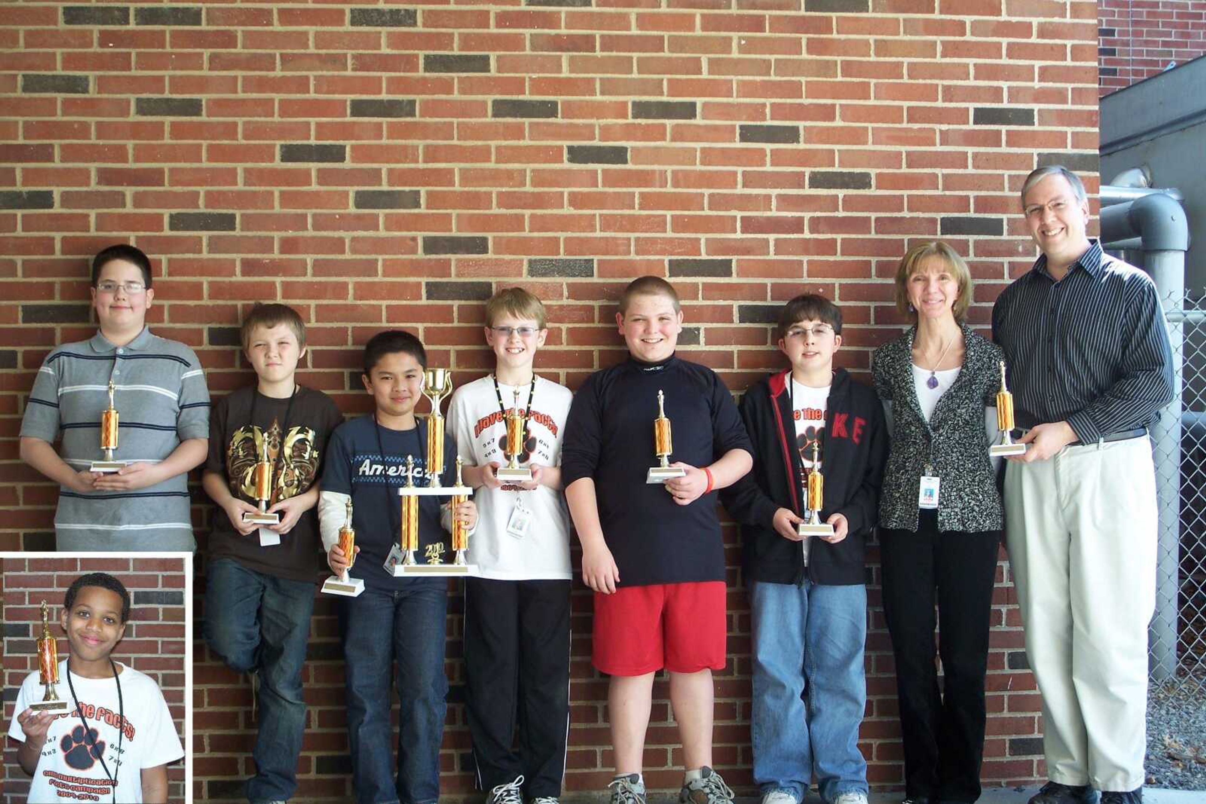 From left to right: Jacob Camp, Best 5th Grade Intermediate; Logan Hann, Best Novice; Samartha Shrestha, Best 6th Grade Advanced/CMS Grand Champion; Bennett Kidd, Best 5th Grade Intermediate; Casey Vaughn, Best 6th Grade Intermediate; Isaac Buck, Best 5th Grade Advanced; Assistant Coach Lesa Hinton, and Chess Coach Jonathan Budil. Inset: Jamonte Rush, Most Improved