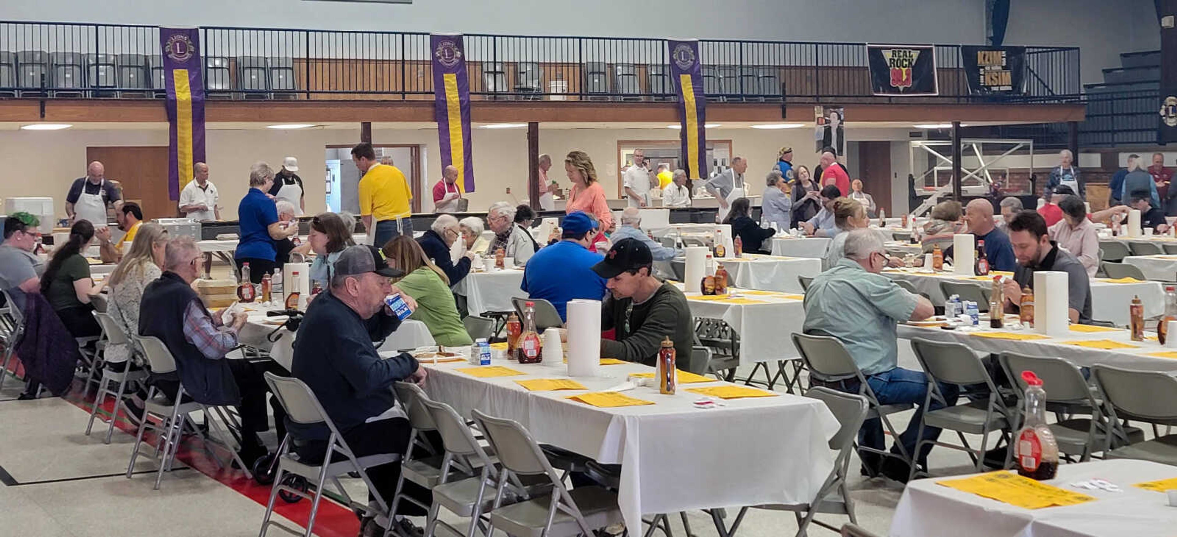 Customers sit and eat during the 84th annual Lions Club Pancake day.