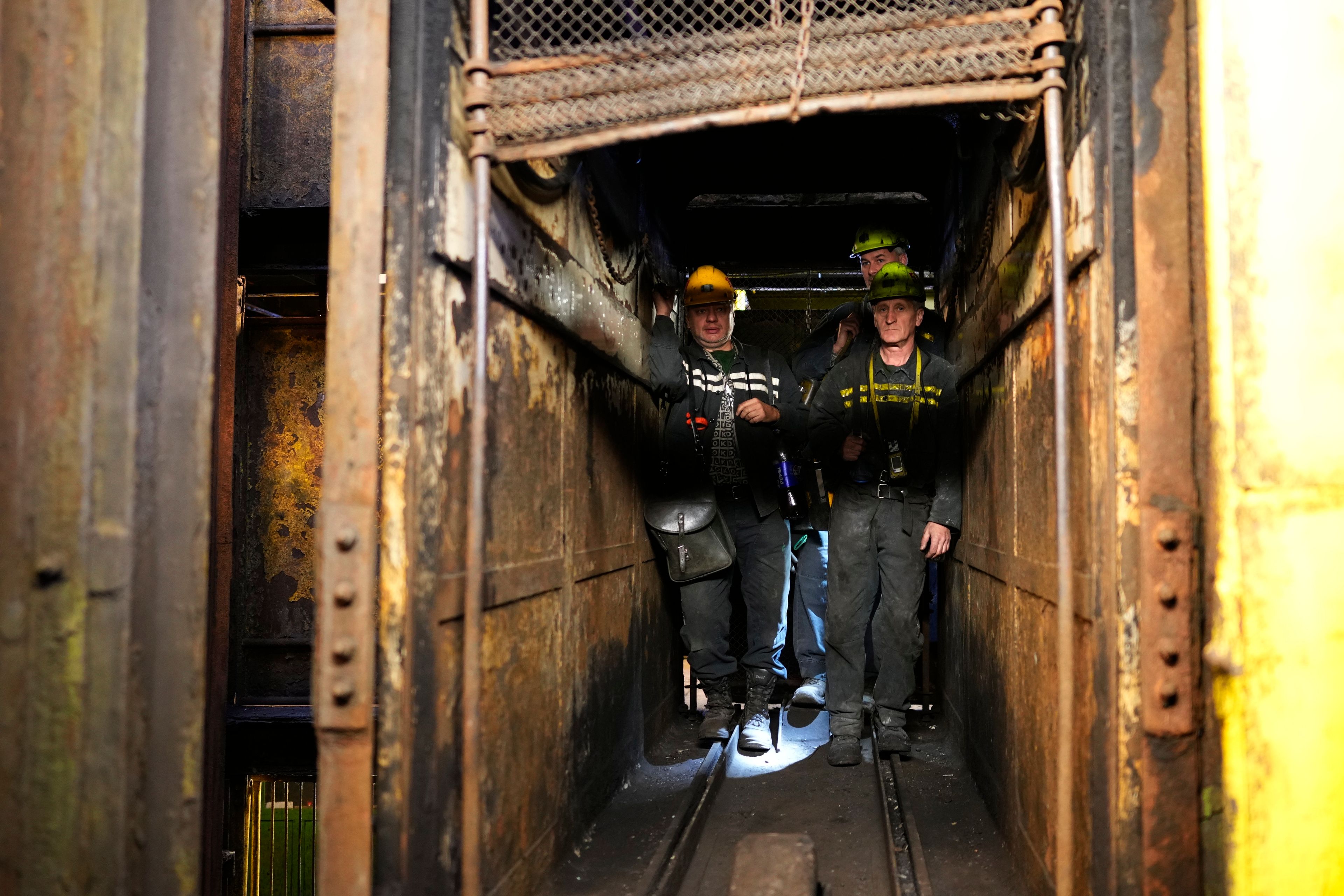 Miners use an elevator to go down to the CSM coal mine in Stonava, Czech Republic, Monday, Oct. 14, 2024. (AP Photo/Petr David Josek)