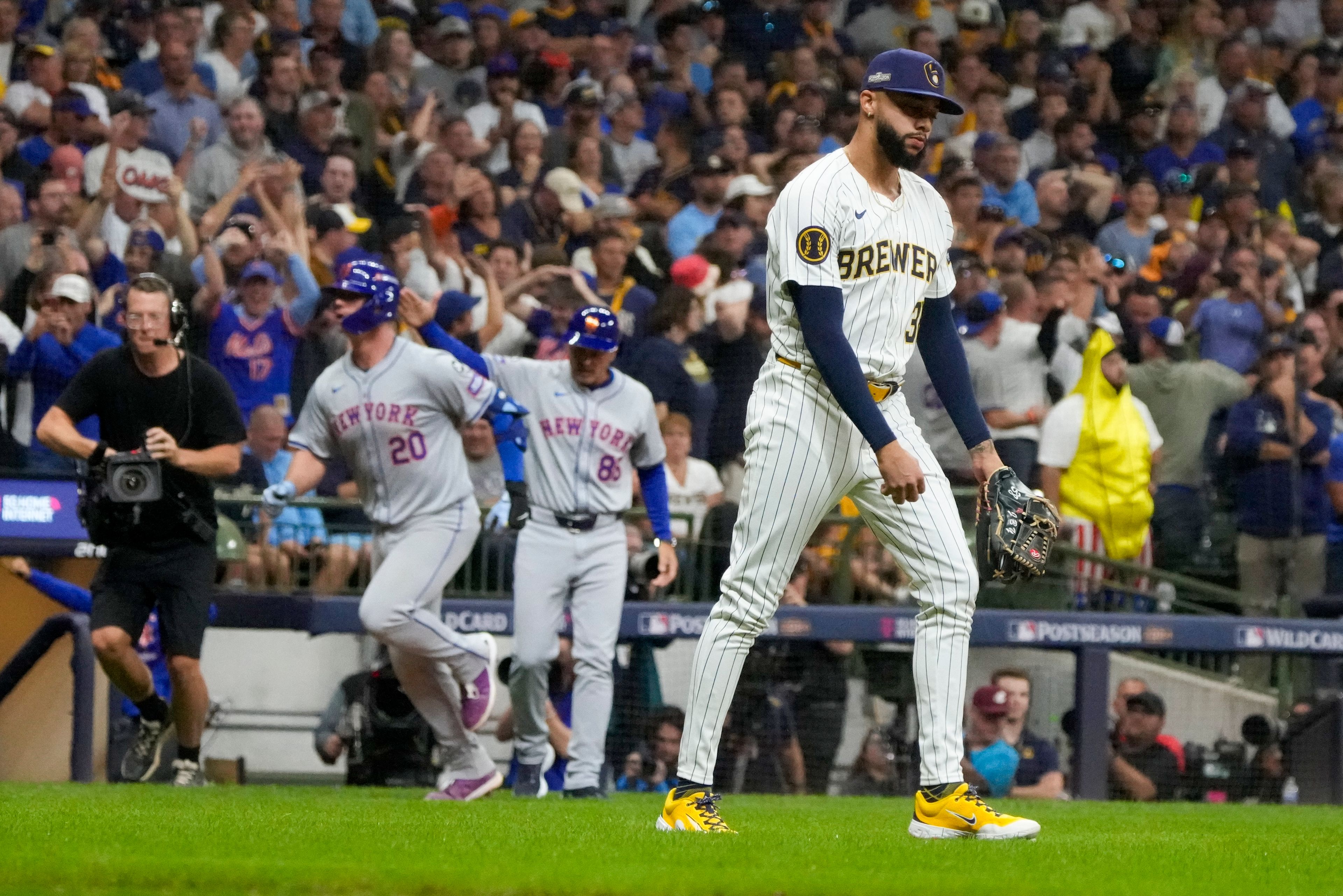 Milwaukee Brewers pitcher Devin Williams reacts after giving up a three-run home run to New York Mets' Pete Alonso during the ninth inning of Game 3 of a National League wild card baseball game Thursday, Oct. 3, 2024, in Milwaukee. (AP Photo/Morry Gash)