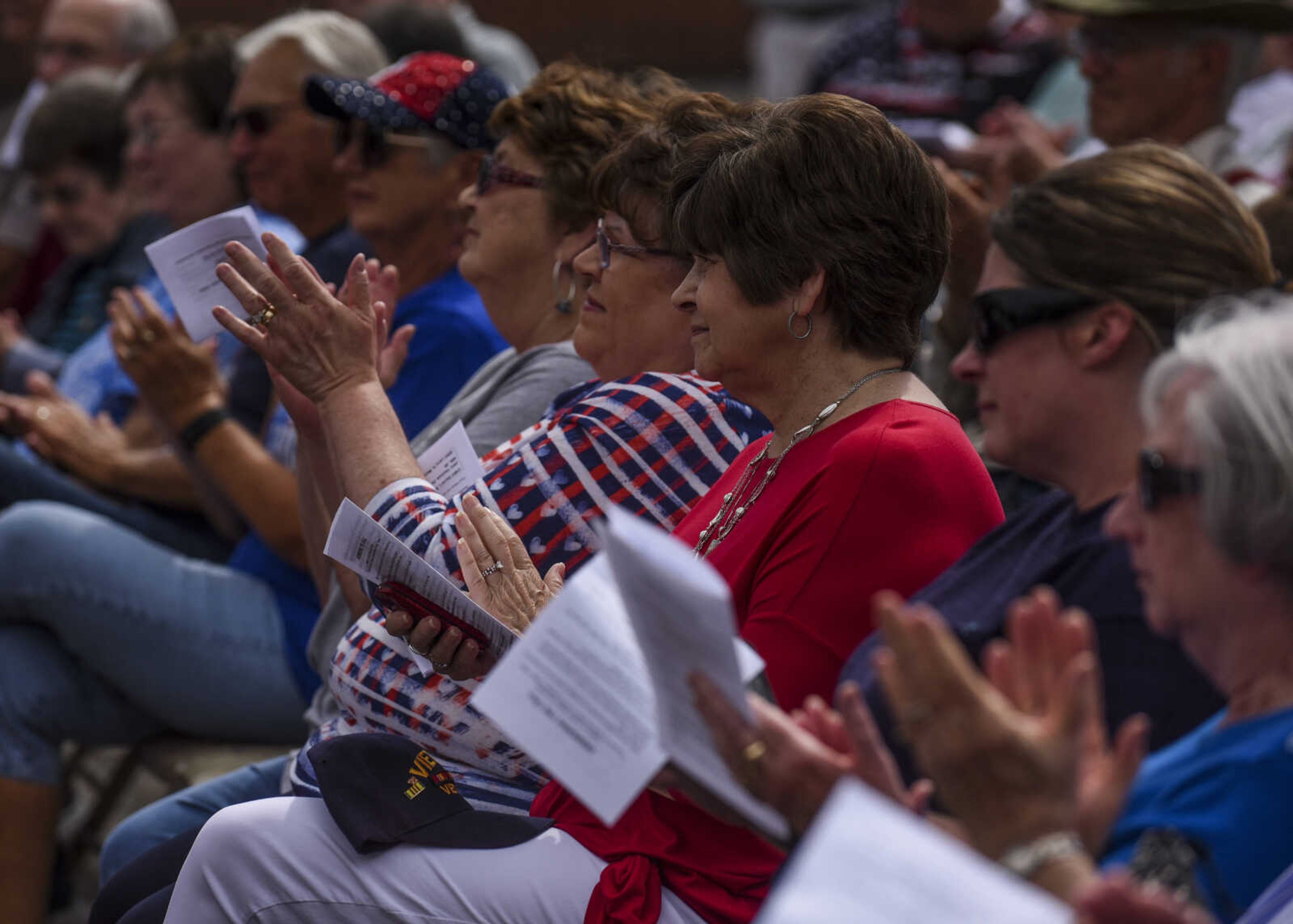 Community members applaud at the Honoring our Military event Saturday, May 5, 2018, at the Scott City Historical Museum in Scott City.