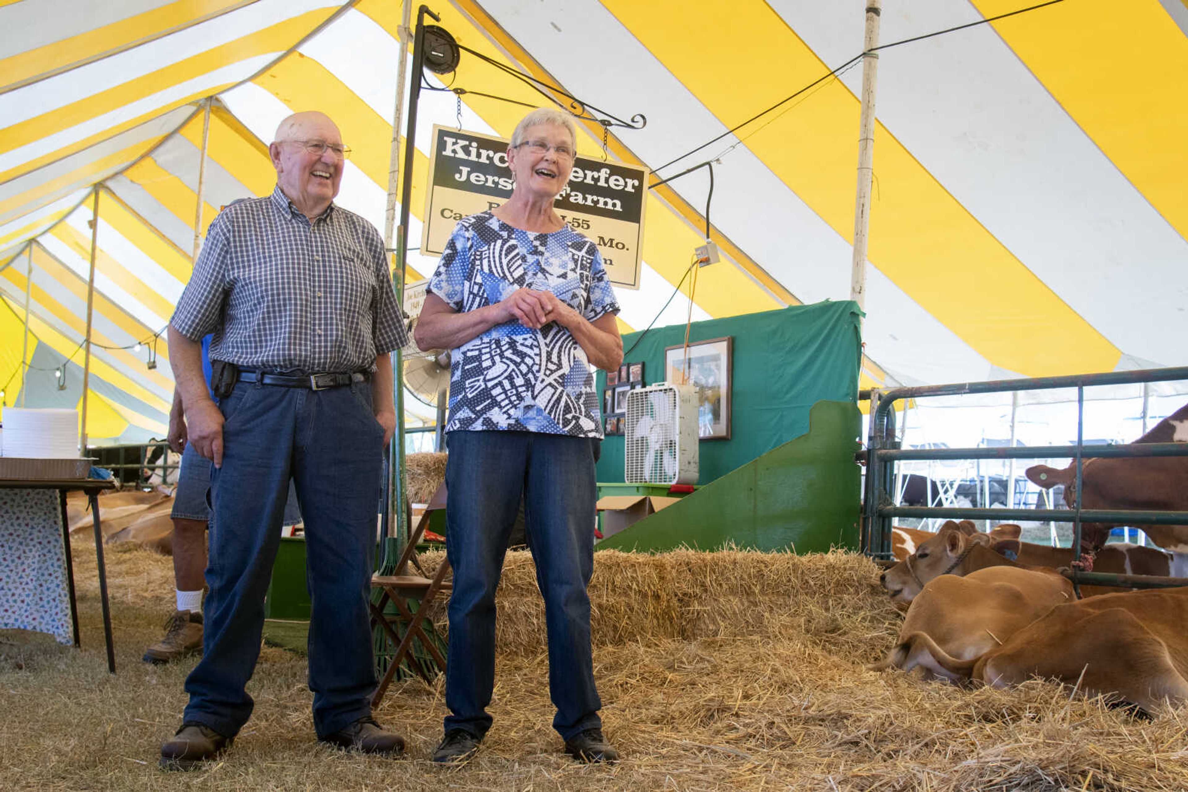 Mildred Kirchdoerfer speaks about her husband Joe, left, to a group gathered for a meal after the jersey cattle showing during the 2019 SEMO District Fair on Monday, Sept. 9, 2019, at Arena Park in Cape Girardeau.