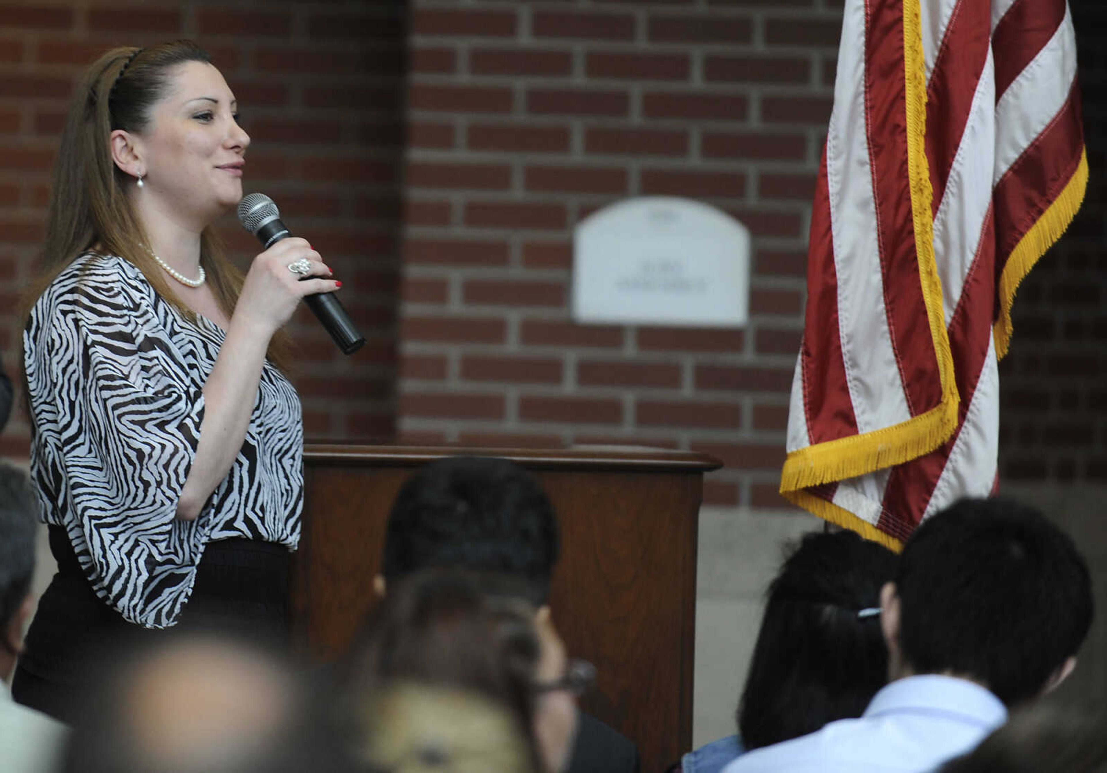 Pilar Nabil Eid, who immigrated to the U.S. from Syria, speaks about becoming a U.S. citizen during a naturalization ceremony Wednesday, May 1, at the Rush H. Limbaugh Sr. U.S. Courthouse in Cape Girardeau. Eid was one of 29 people from 11 countries who were administered the Oath of Allegiance, making them U.S. citizens, by U.S. District Court Judge Stephen N. Limbaugh Jr. during the ceremony.