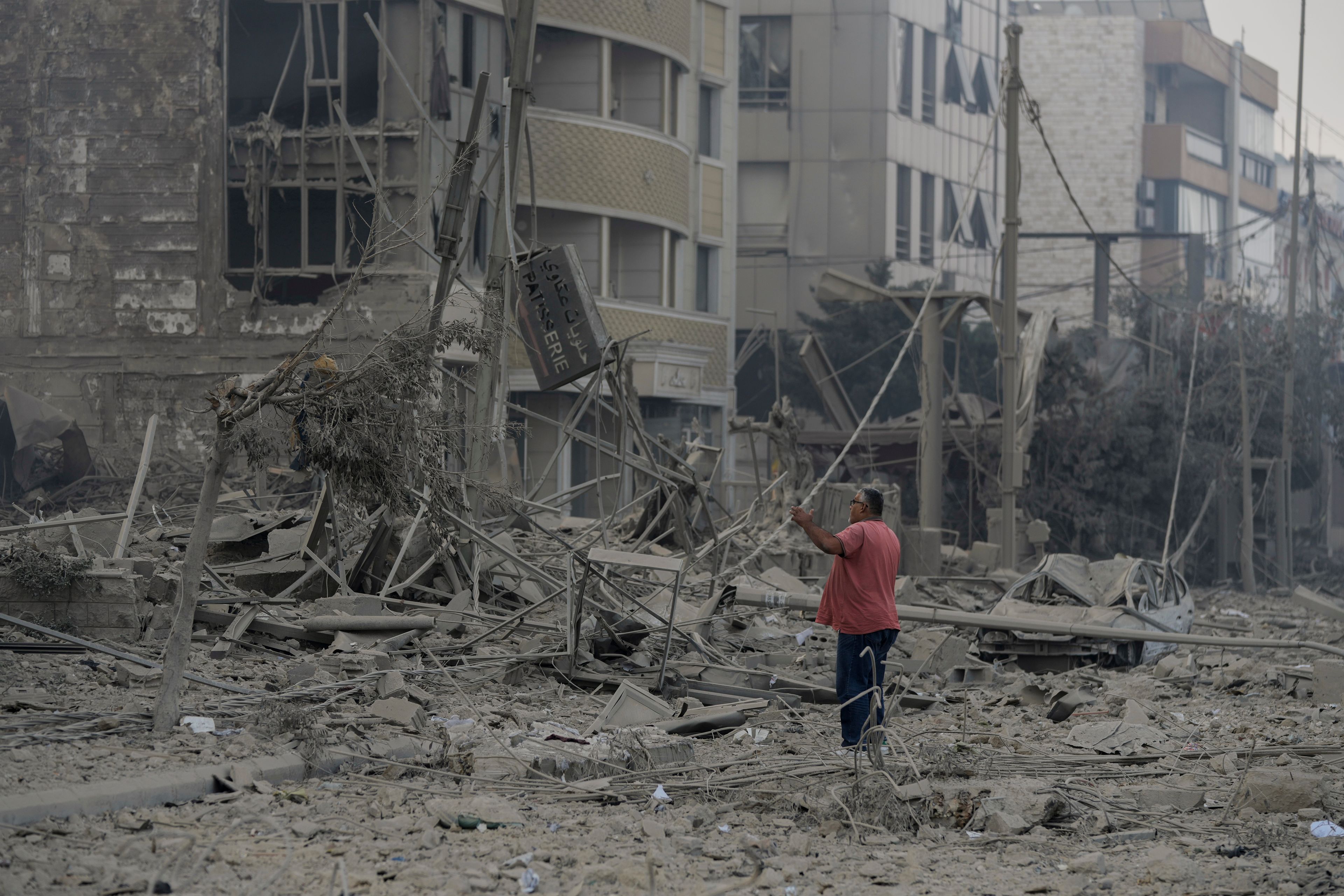 A man checks the site of an Israeli airstrike in Dahiyeh, Beirut, Lebanon, Sunday, Oct. 6, 2024. (AP Photo/Bilal Hussein)