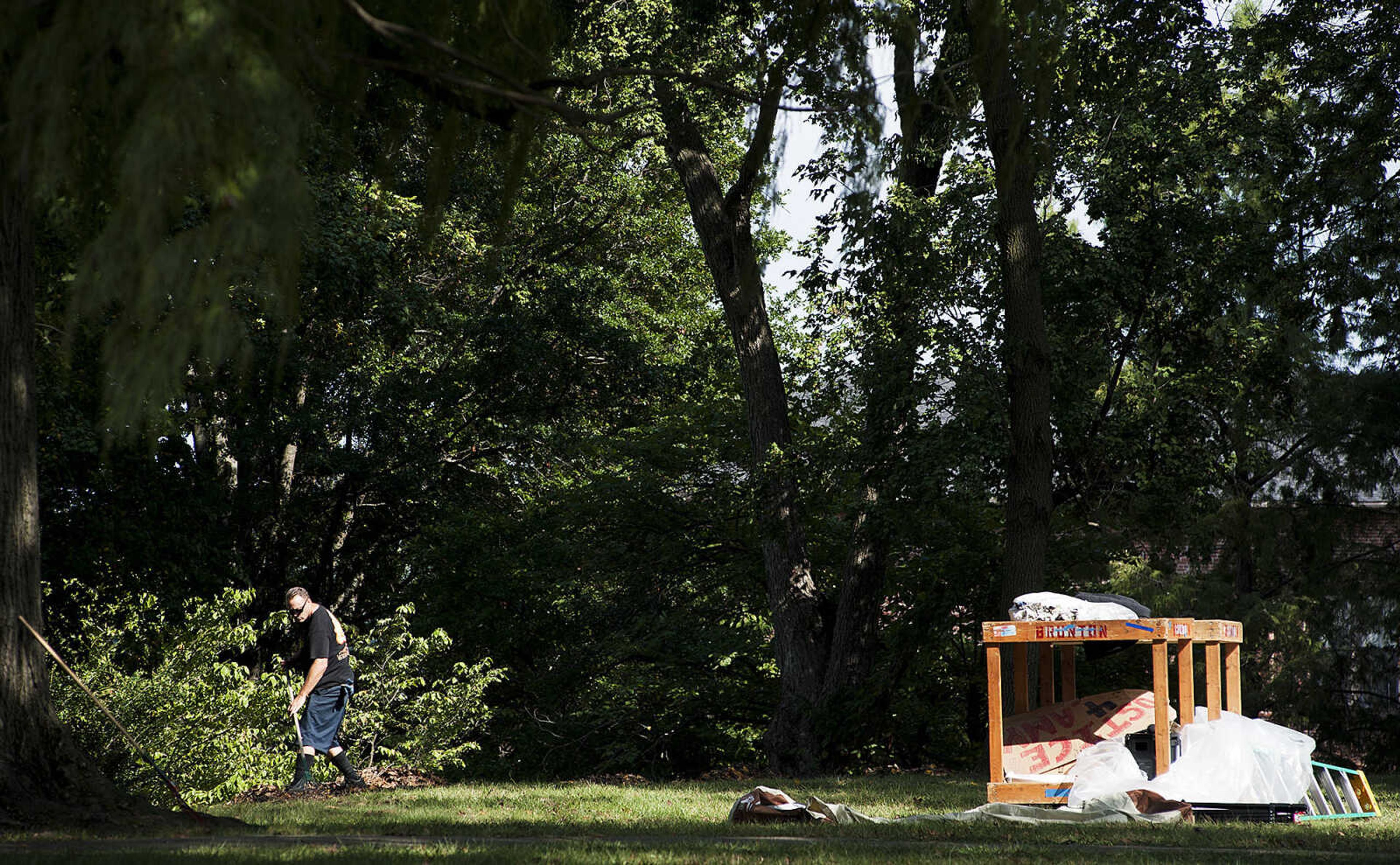 ADAM VOGLER ~ avogler@semissourian.com
A crew member for the 20th Century Fox feature film "Gone Girl," rakes leaves on the lawn of the Common Pleas Courthouse prior to filming Thursday, Oct. 3, in downtown Cape Girardeau.