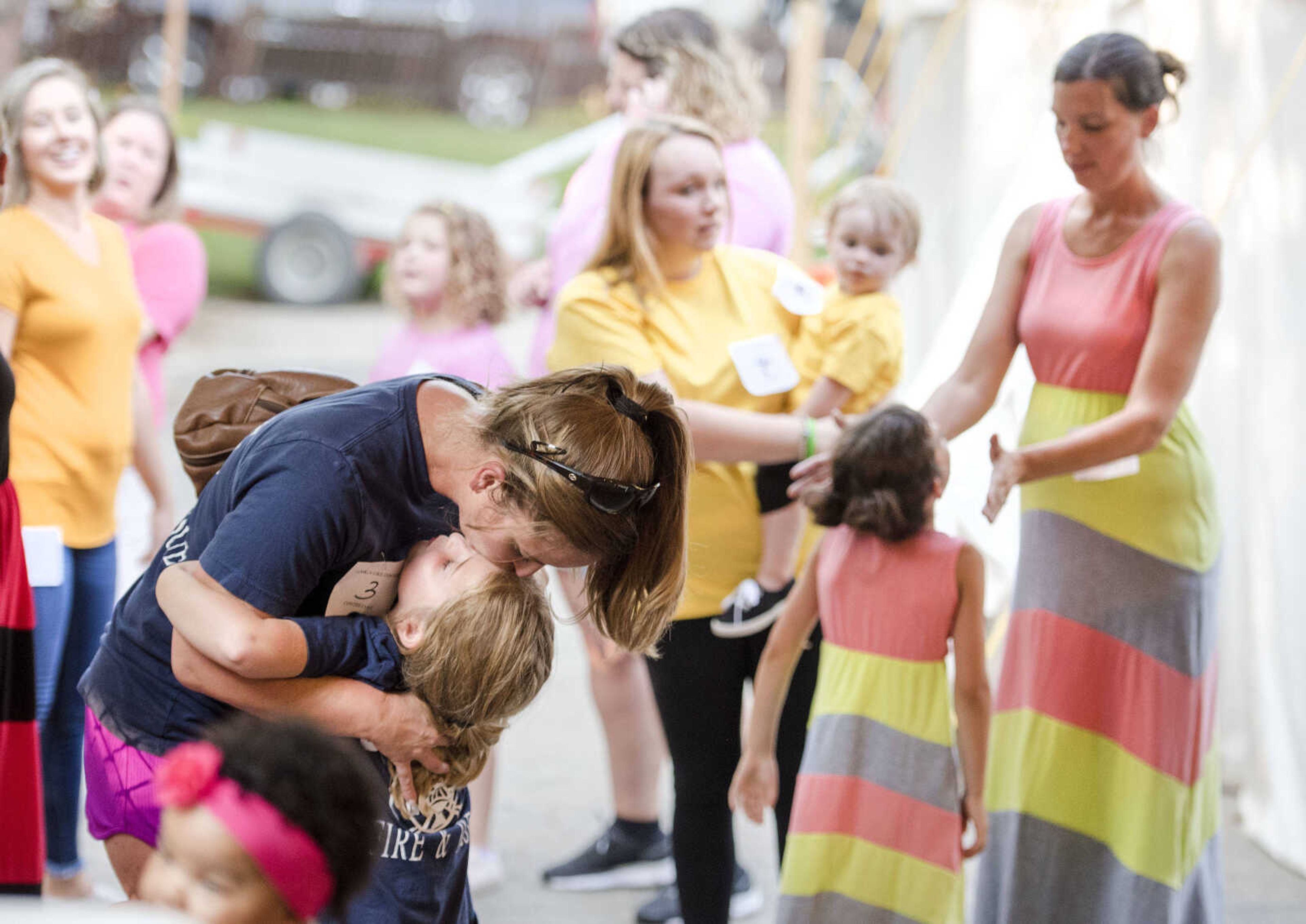 Oak Ridge mother Stefanie Buchheit kisses her daughter Beka, 7, on the head as judges make their decisions in the Mother Daughter Lookalike contest Sept. 9, 2019, at the SEMO District Fair in Cape Girardeau.