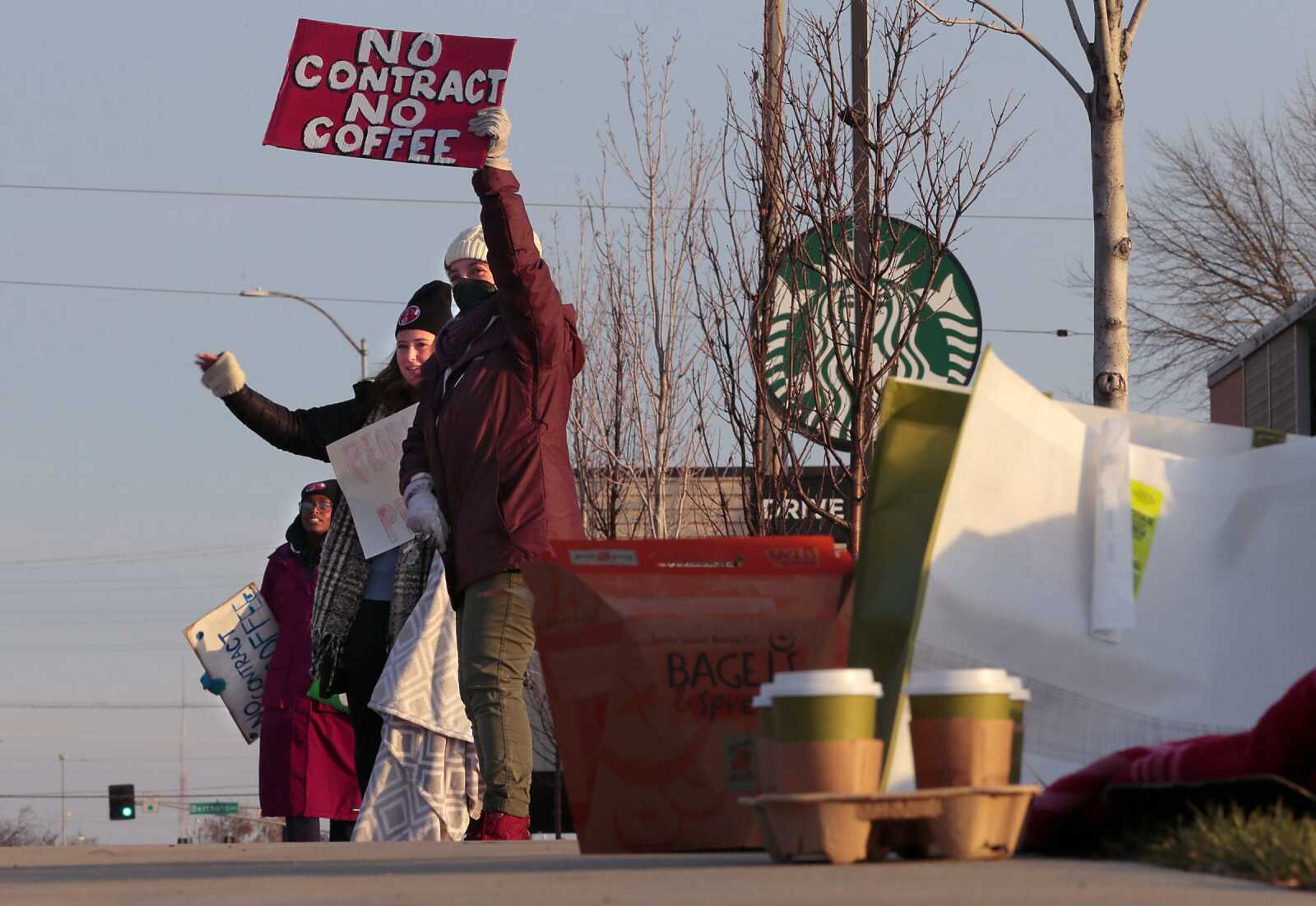 Starbucks employees work the picket line during a one-day walkout involving more than 100 stores nationwide Thursday, Nov. 17, in St. Louis. It's largest labor action since a campaign to unionize Starbucks' stores began late last year.