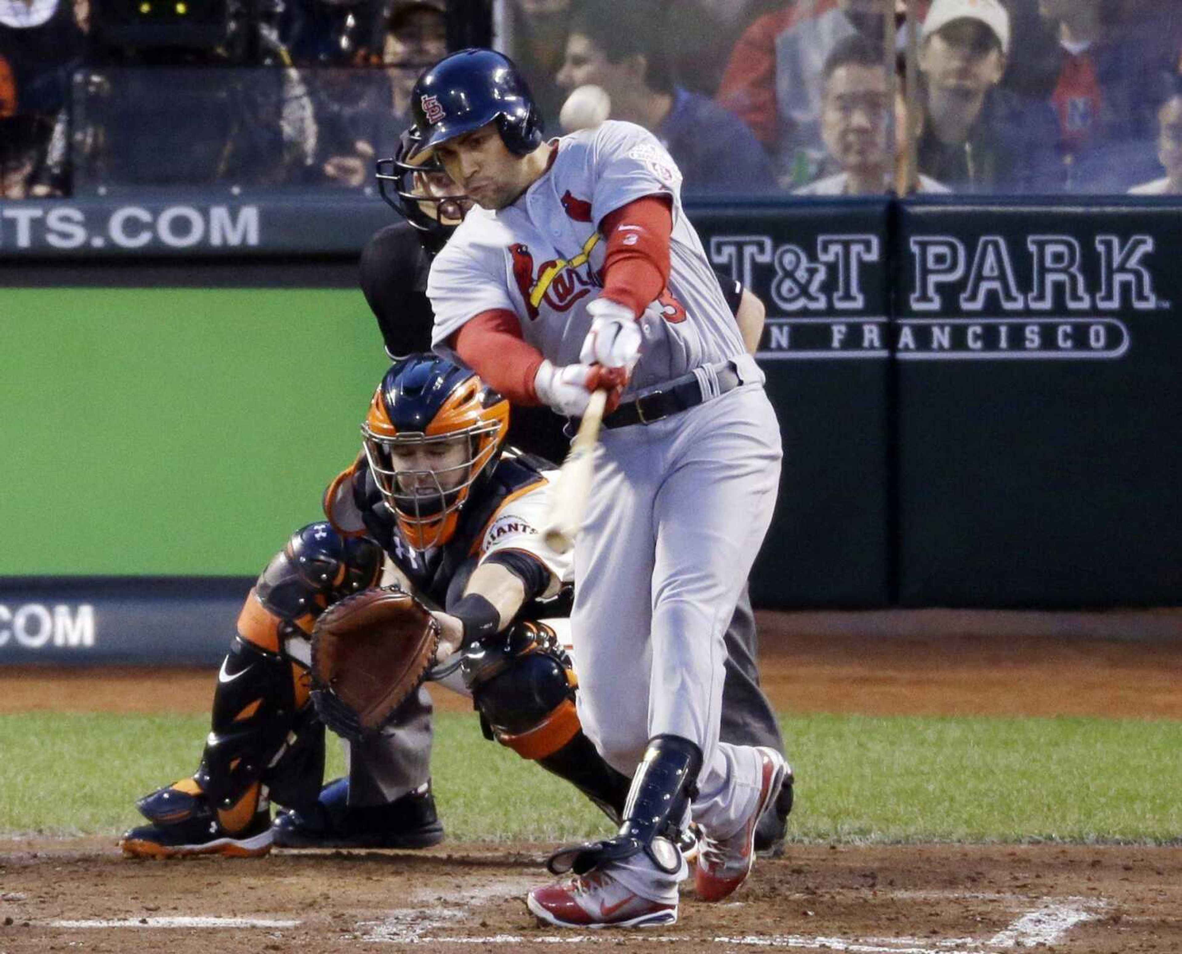 The Cardinals&#8217; Carlos Beltran hits a two-run home run against the Giants during the fourth inning of Game 1 of the National League championship series Sunday in San Francisco. (Mark Humphrey ~ Associated Press)