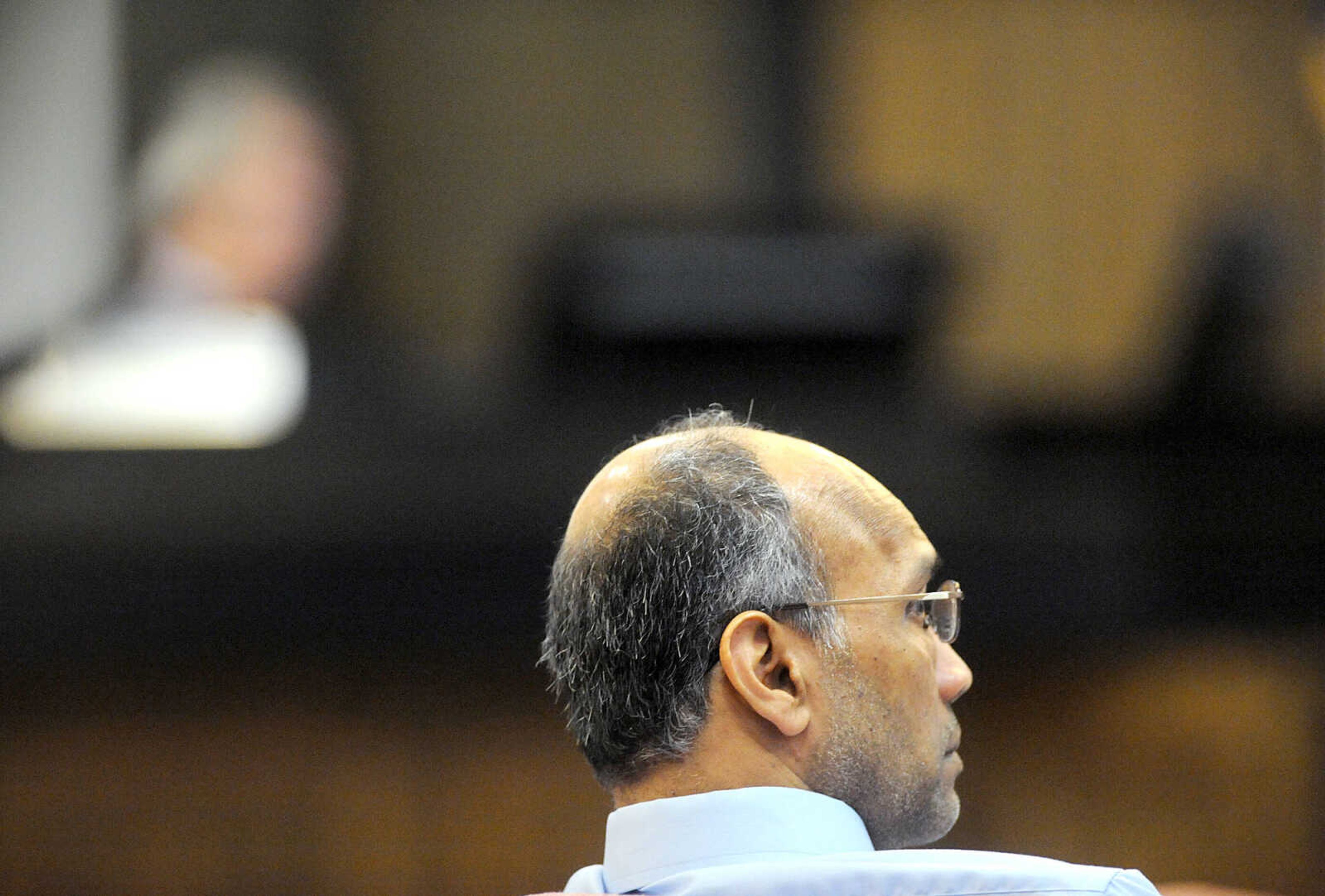 LAURA SIMON ~ lsimon@semissourian.com

George Joseph listens to opening statements during double-murder trial, Monday, July 20, 2015, at the Cape Girardeau County Courthouse in Jackson, Missouri. Joseph is accused in the 2013 shooting deaths of his wife, Mary Joseph, and son, Matthew Joseph, at their home on West Cape Rock Drive.