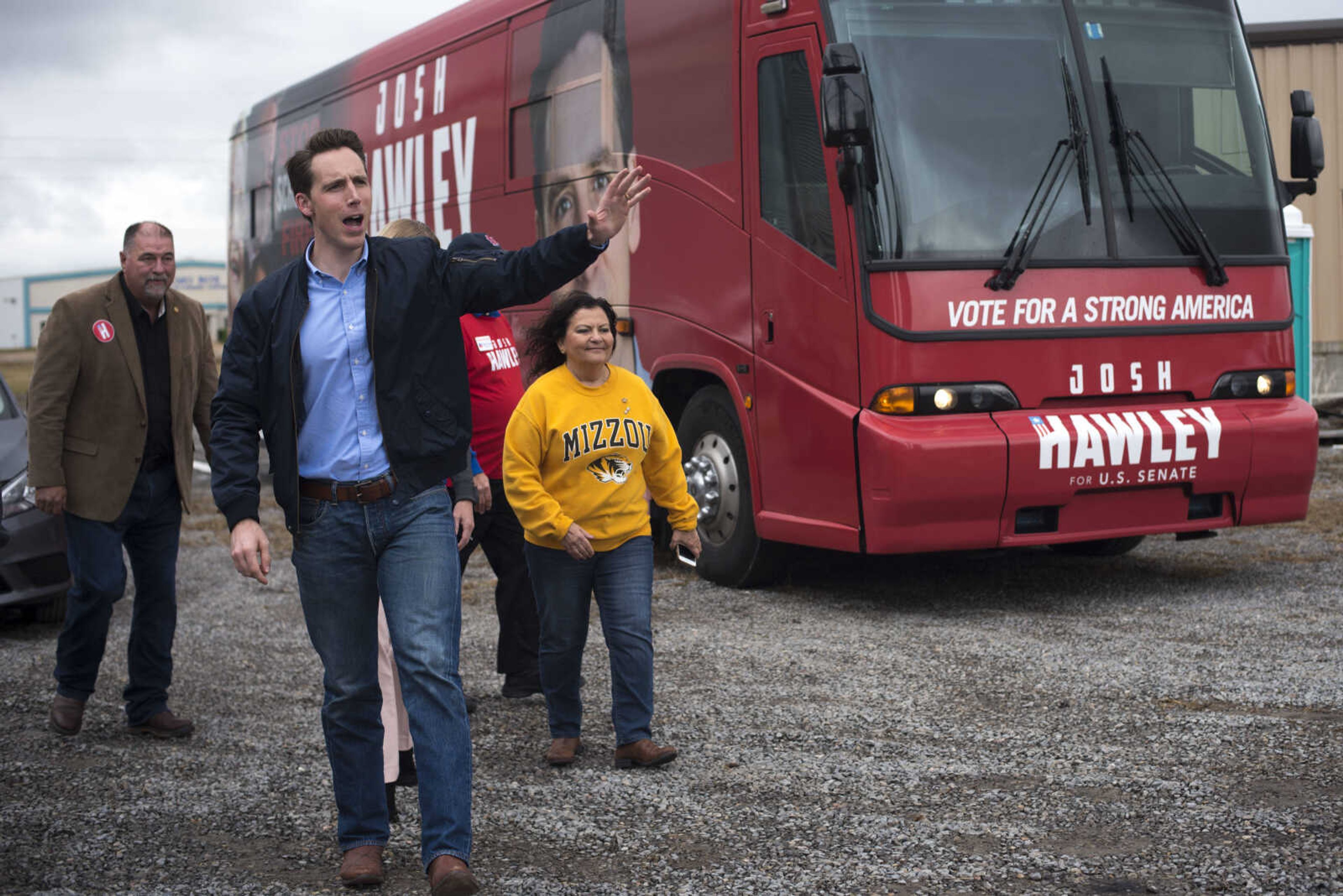 Missouri Republican candidate Josh Hawley waves to a crowd of supporters Friday, Oct. 26, 2018, after stepping off the bus for a campaign rally in Scott City.