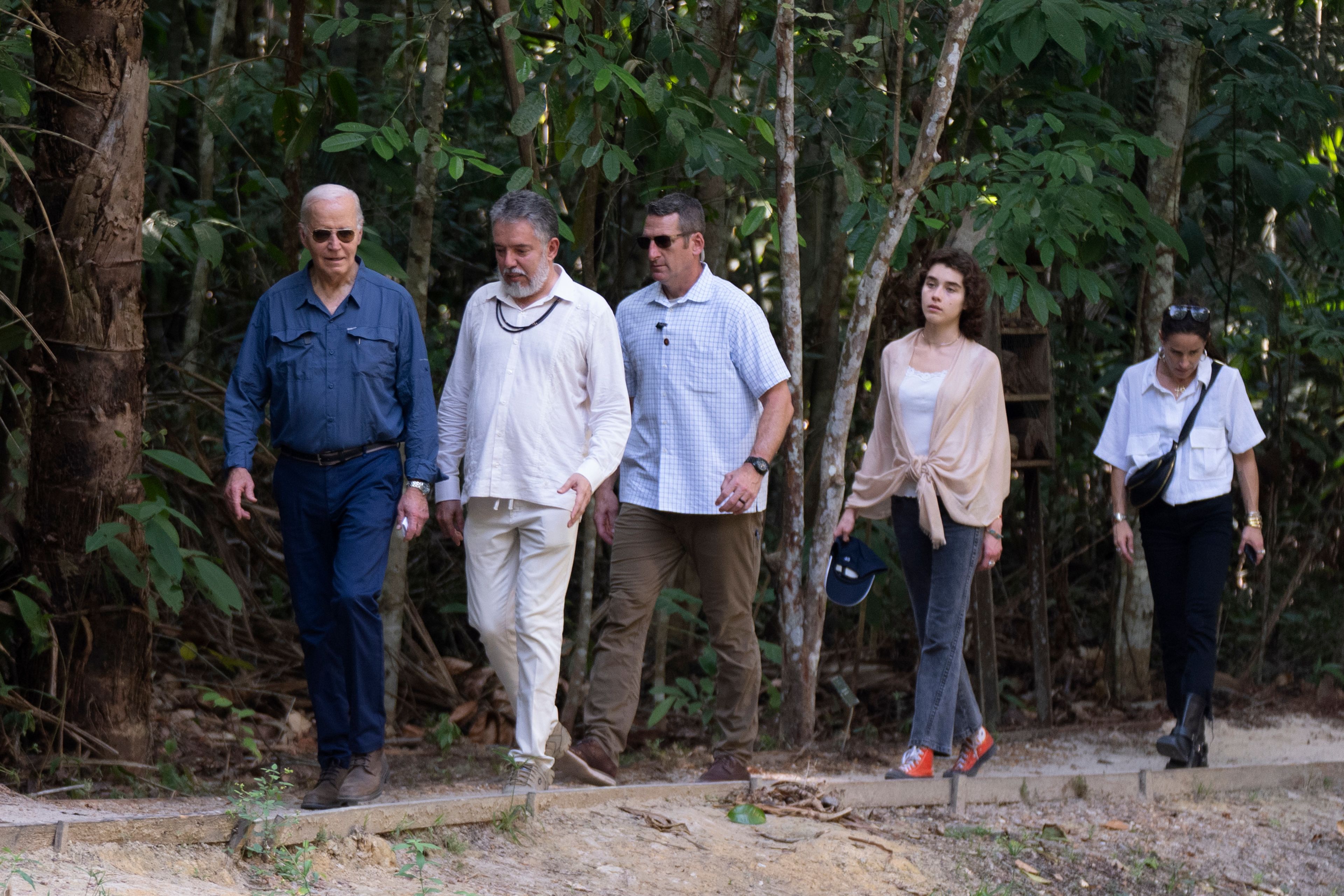 President Joe Biden, from left, walks with Henrique Pereira, director of the National Institute for Research in the Amazon, granddaughter Natalie Biden, second right, and daughter Ashley Biden, right, during a tour of the Museu da Amazonia in Manaus, Brazil, Sunday, Nov. 17, 2024. (AP Photo/Manuel Balce Ceneta)