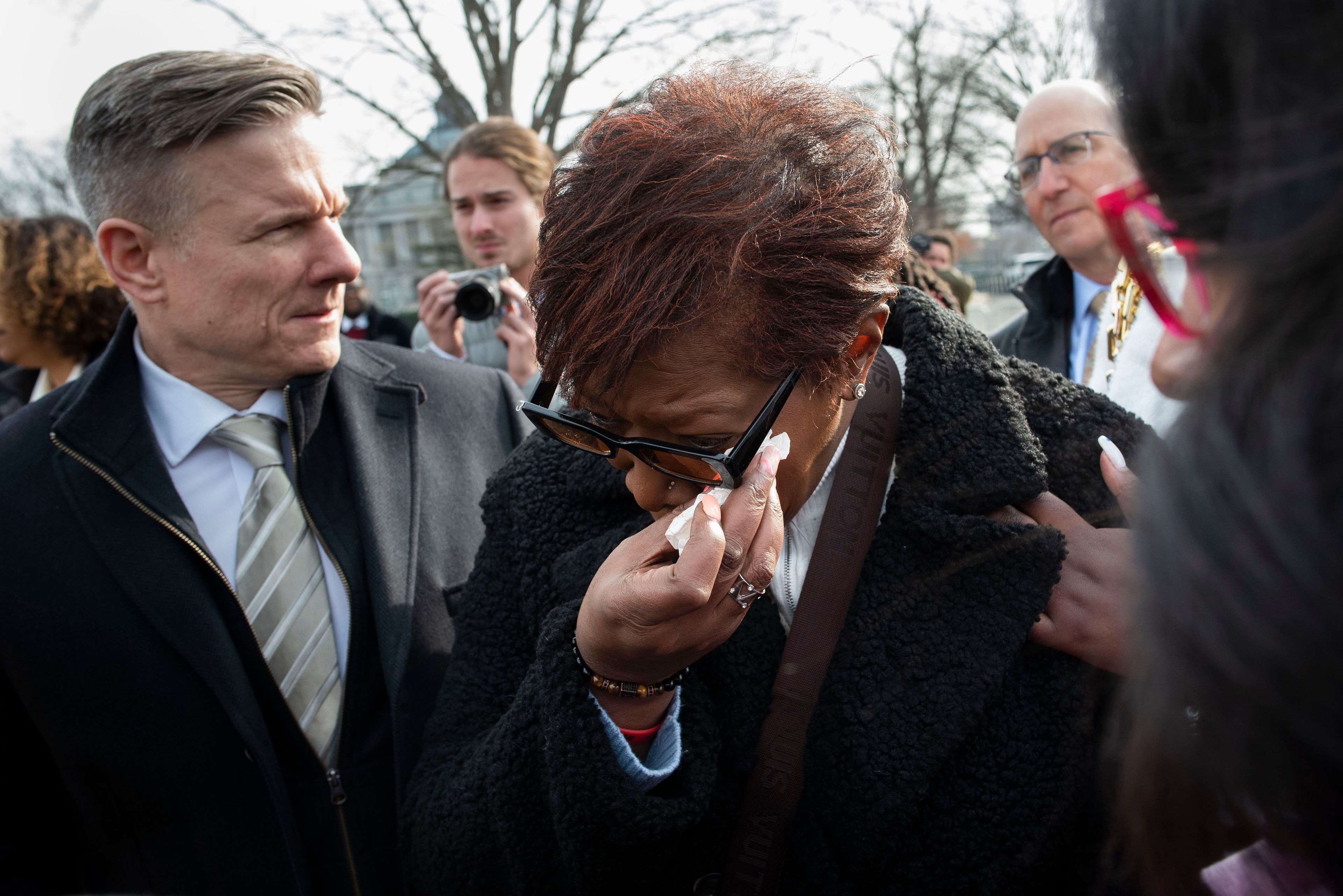 FILE - Pamela Walker, mother of Jayland Walker, who was shot and killed by police in Akron, Ohio, is comforted prior to appearing before reporters about police reform, on Capitol Hill in Washington, on Feb. 7, 2023. (AP Photo/Cliff Owen, File)